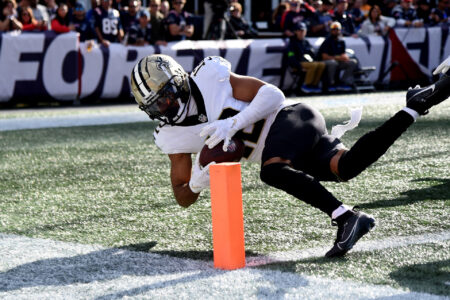 Oct 8, 2023; Foxborough, Massachusetts, USA; New Orleans Saints wide receiver Chris Olave (12) can’t control the ball as he crosses the end zone during the second half against the New England Patriots at Gillette Stadium.