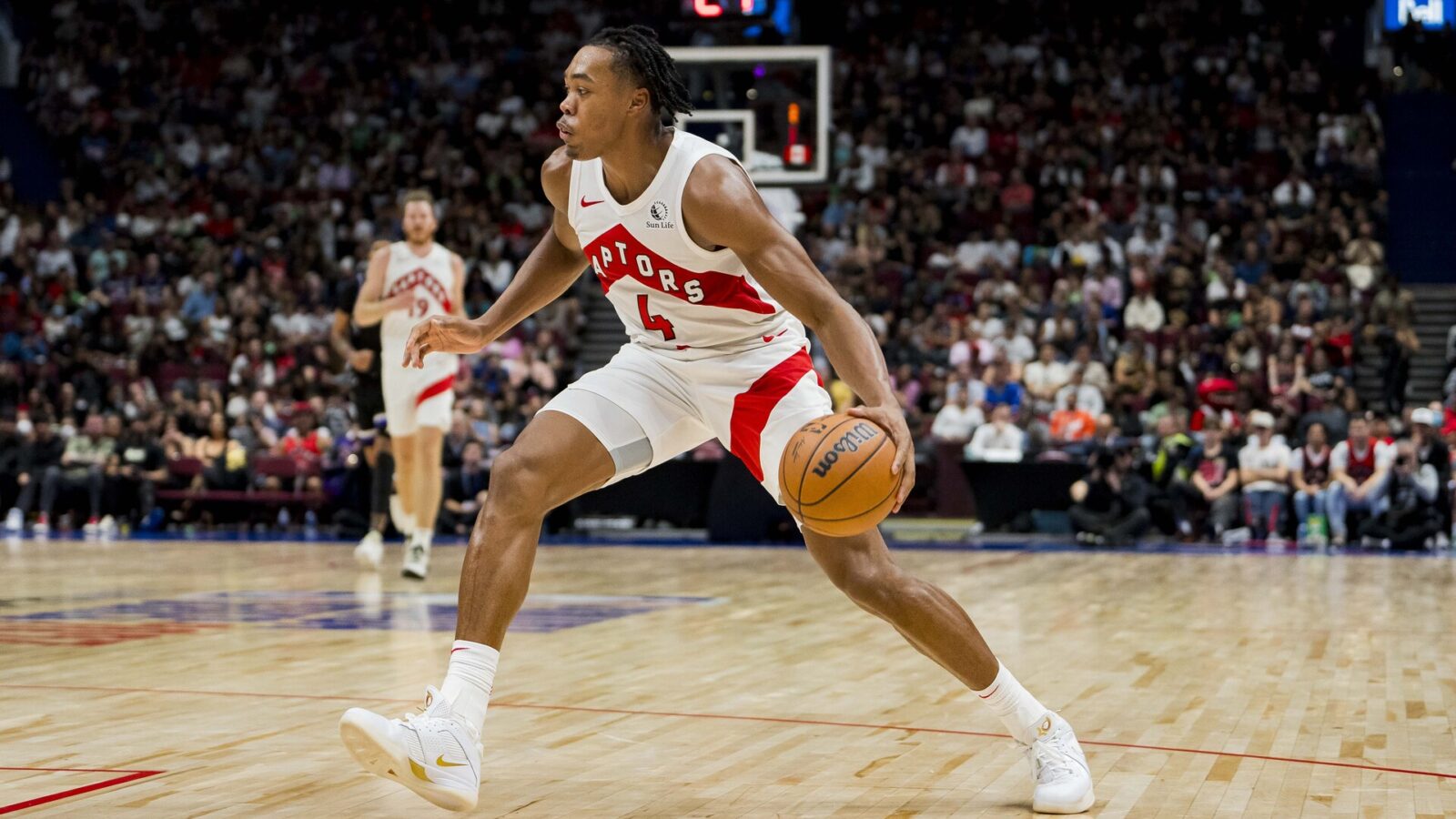 Oct 8, 2023; Vancouver, British Columbia, CAN; Toronto Raptors forward Scottie Barnes (4) dribbles the ball against the Sacramento Kings in the second half at Rogers Arena. Raptors won 112-99.