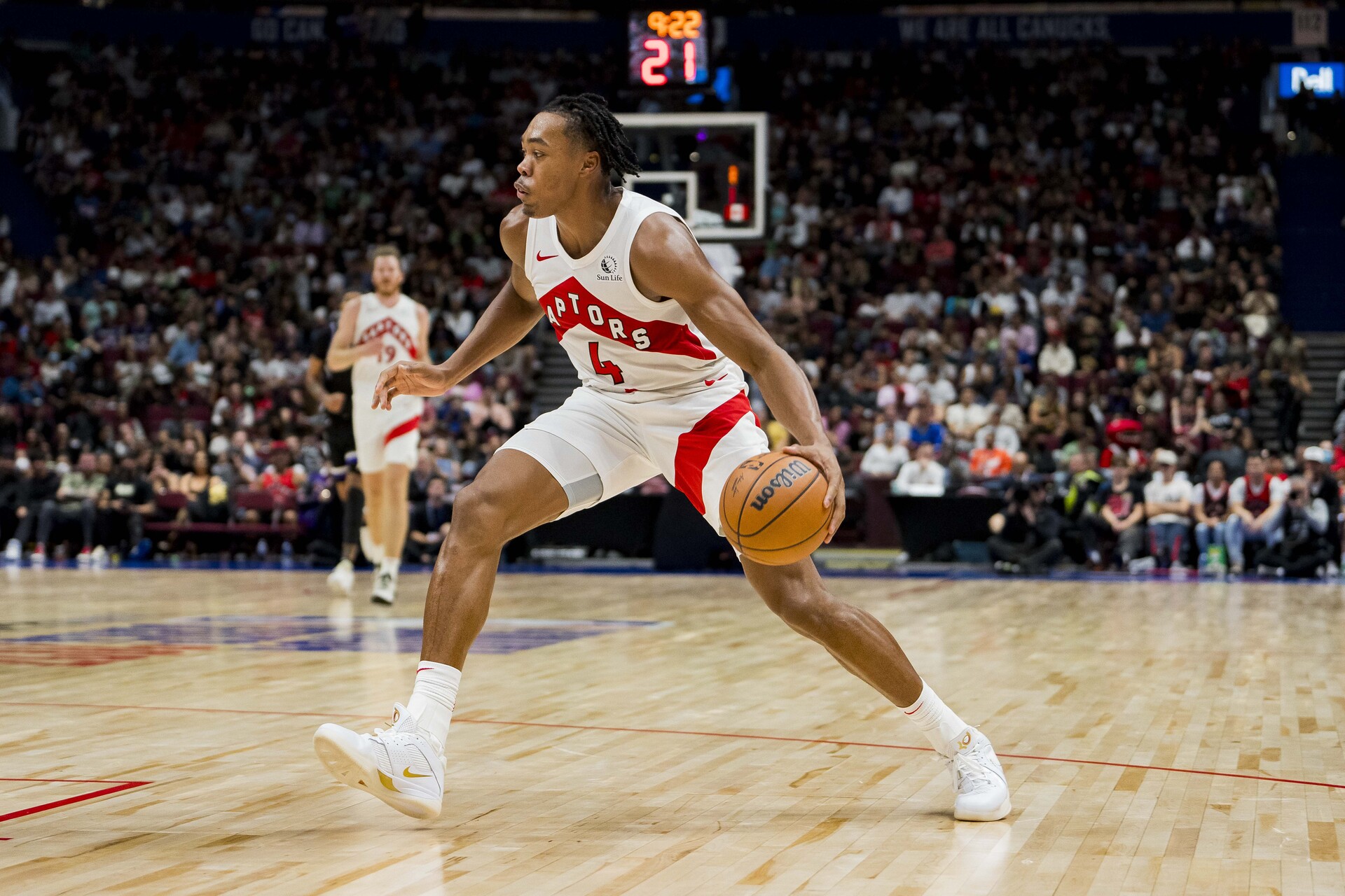 Oct 8, 2023; Vancouver, British Columbia, CAN; Toronto Raptors forward Scottie Barnes (4) dribbles the ball against the Sacramento Kings in the second half at Rogers Arena. Raptors won 112-99.