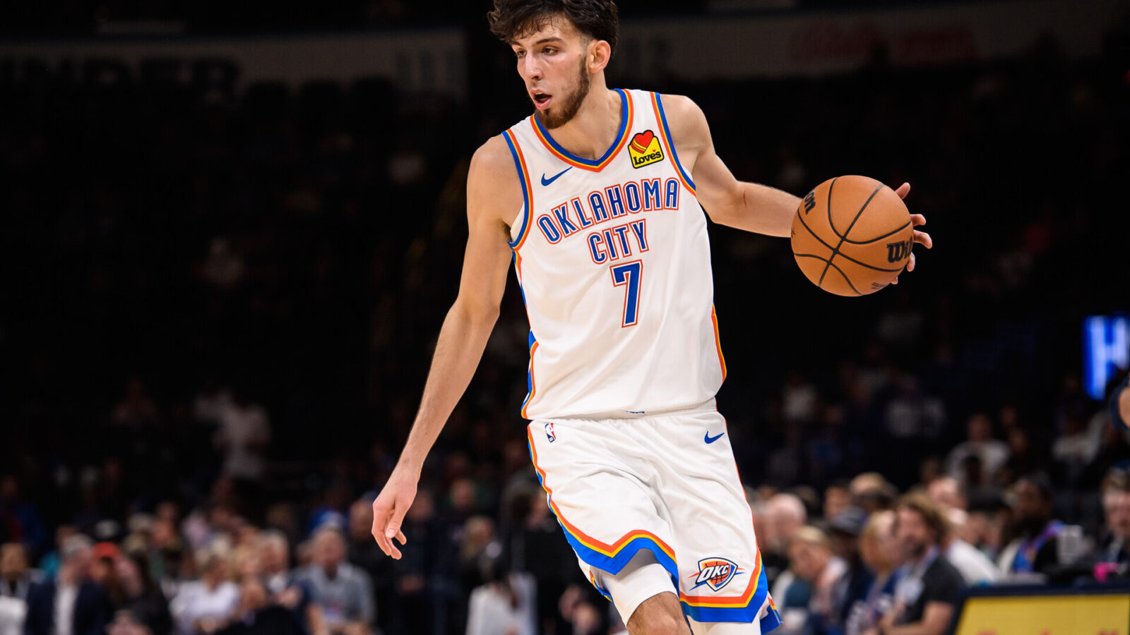 Oklahoma City Thunder forward Chet Holmgren (7) dribbles the ball during the game against the San Antonio Spurs at Paycom Center.