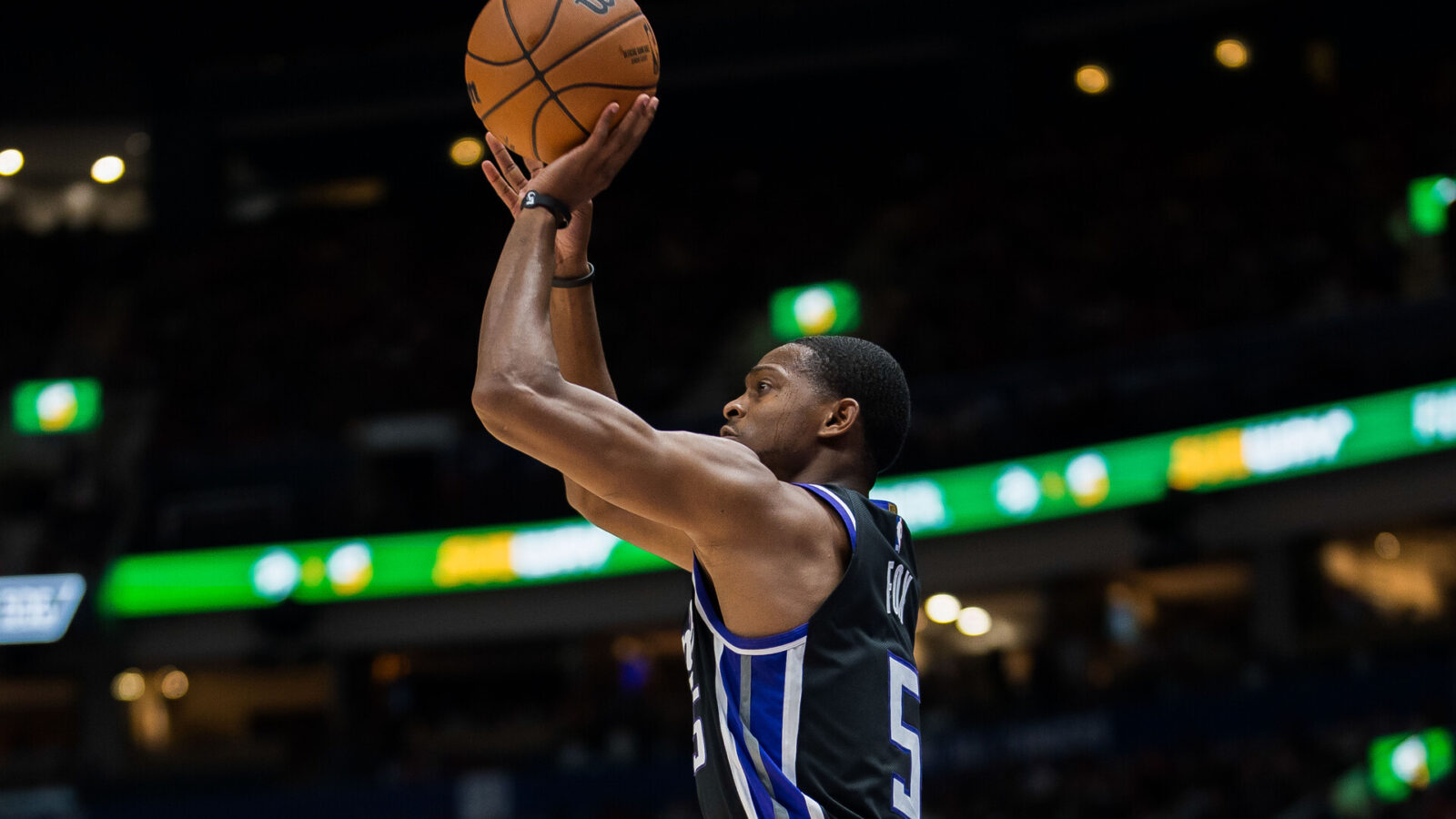 Oct 8, 2023; Vancouver, British Columbia, CAN; Sacramento Kings guard De'Aaron Fox (5) makes a three point attempt against the Toronto Raptors in the first half at Rogers Arena.