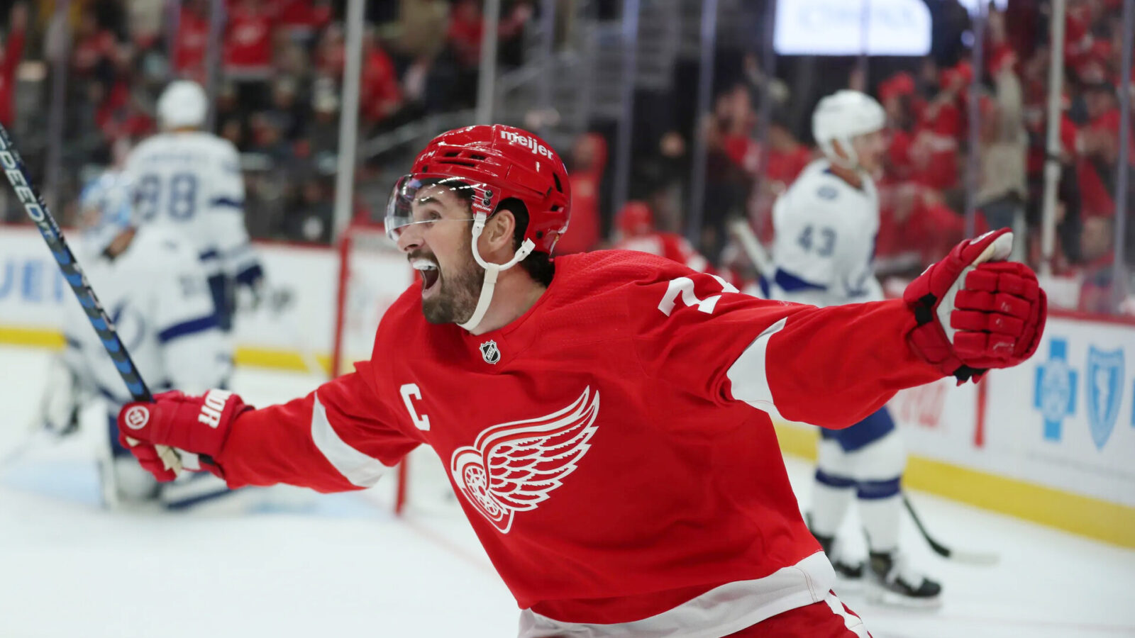 Detroit Red Wings center Dylan Larkin celebrates a goal by right wing Alex DeBrincat against Tampa Bay Lightning goaltender Jonas Johansson during first-period action on Saturday, Oct. 14, 2023, in Detroit, Michigan.