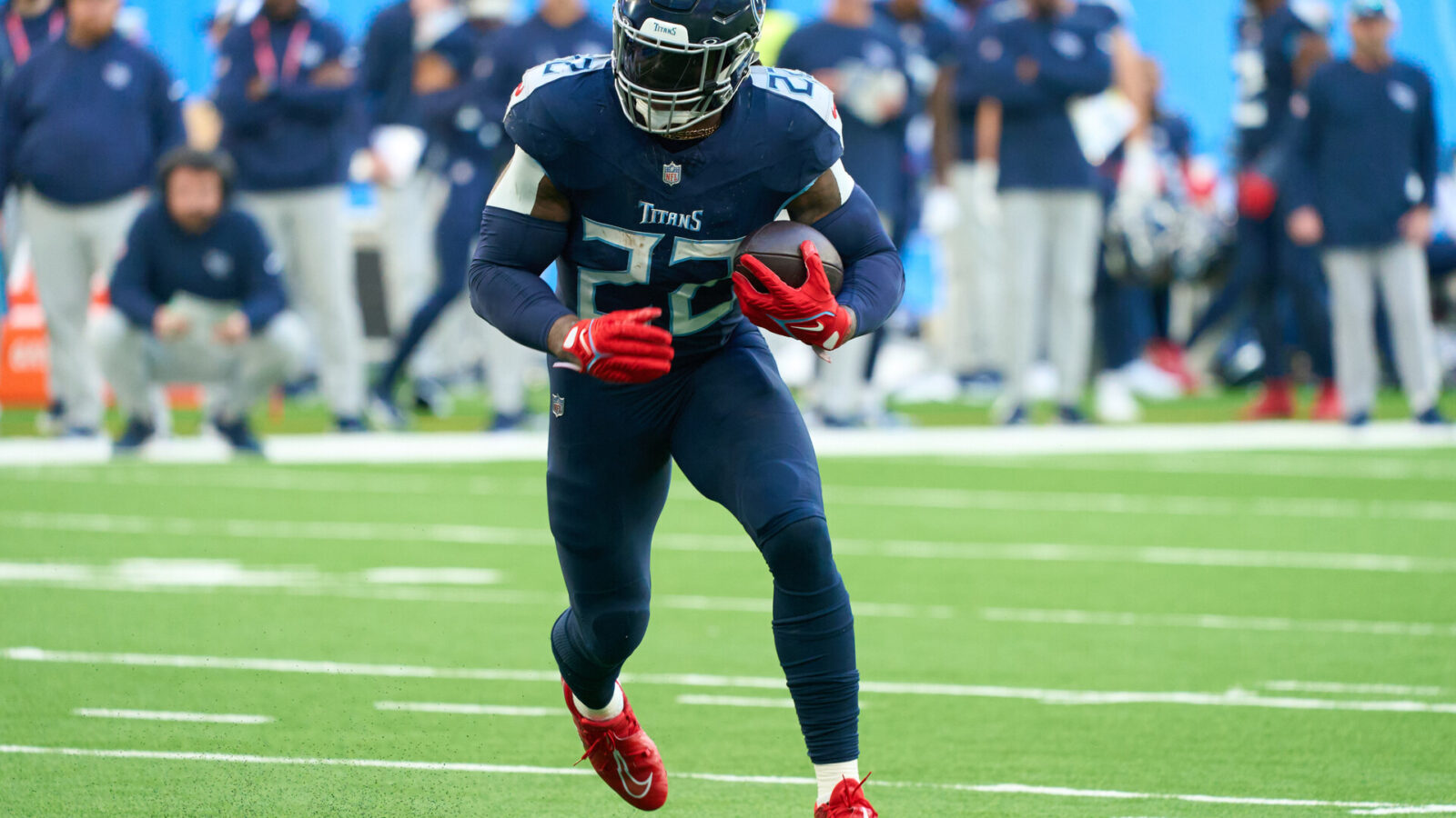 Oct 15, 2023; London, United Kingdom; Tennessee Titans running back Derrick Henry (22) runs in for a touchdown during the second half of an NFL International Series game at Tottenham Hotspur Stadium.
