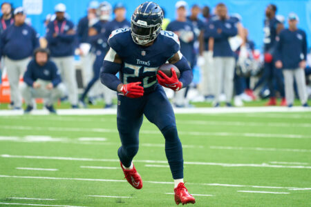 Oct 15, 2023; London, United Kingdom; Tennessee Titans running back Derrick Henry (22) runs in for a touchdown during the second half of an NFL International Series game at Tottenham Hotspur Stadium.