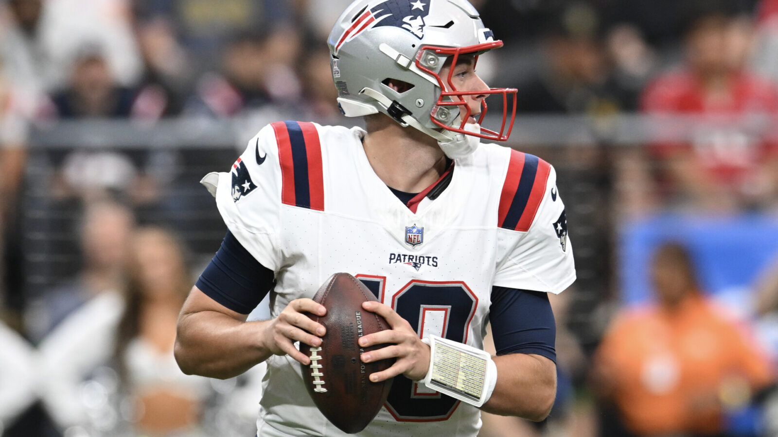Oct 15, 2023; Paradise, Nevada, USA; New England Patriots quarterback Mac Jones (10) looks to make a pass in the first quarter against the Las Vegas Raiders at Allegiant Stadium.