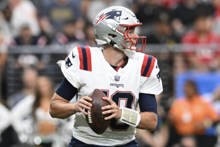 Oct 15, 2023; Paradise, Nevada, USA; New England Patriots quarterback Mac Jones (10) looks to make a pass in the first quarter against the Las Vegas Raiders at Allegiant Stadium.