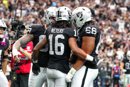 Oct 15, 2023; Paradise, Nevada, USA; Las Vegas Raiders wide receiver Jakobi Meyers (16) celebrates with team mates after scoring a touchdown against the New England Patriots during the second quarter at Allegiant Stadium.