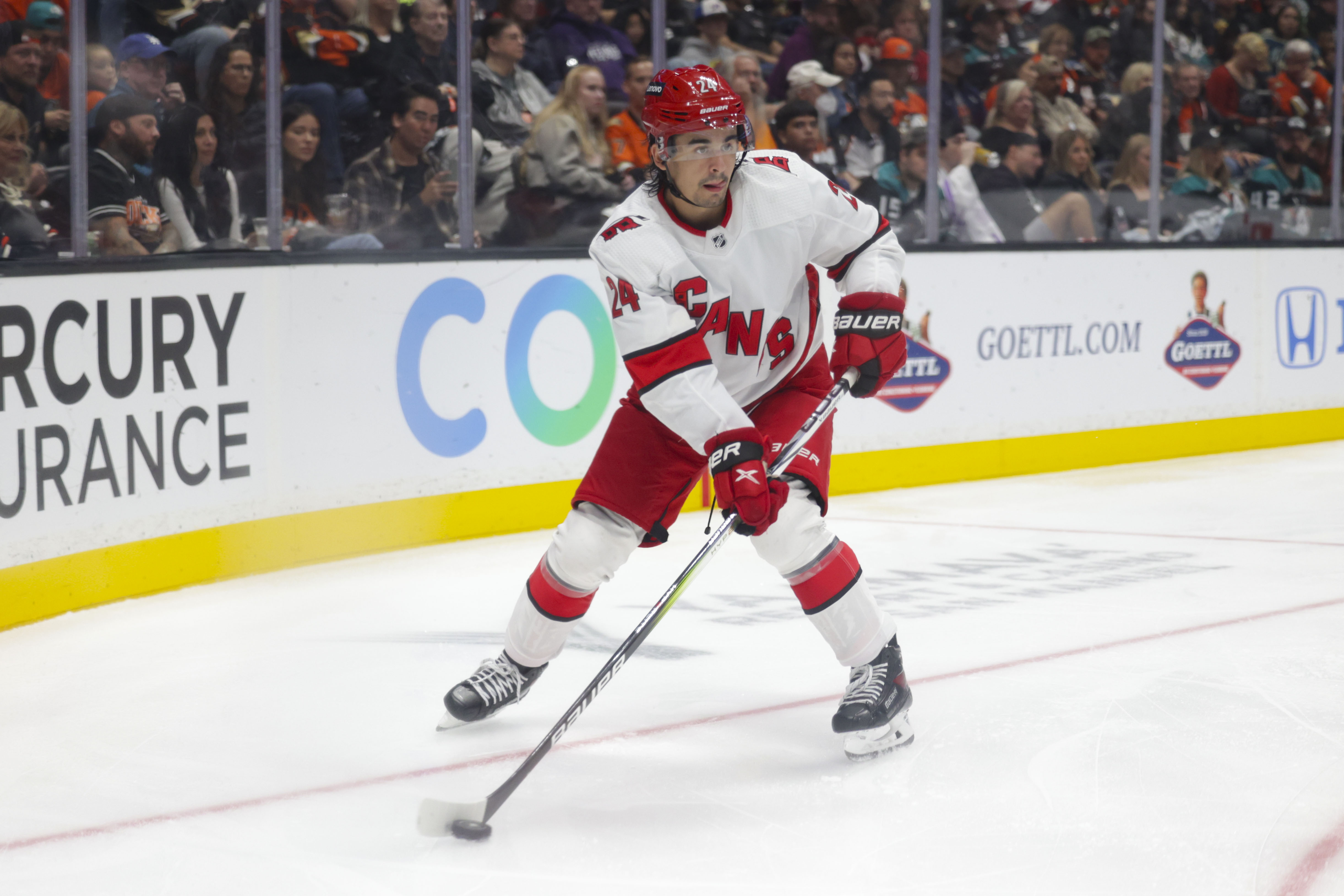 Oct 15, 2023; Anaheim, California, USA; Carolina Hurricanes center Seth Jarvis (24) skates with the puck during the third period against the Anaheim Ducks at Honda Center.