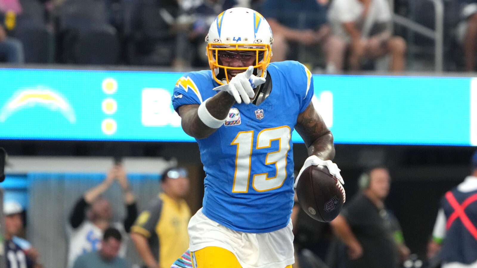 Oct 16, 2023; Inglewood, California, USA; Los Angeles Chargers wide receiver Keenan Allen (13) celebrates after scoring on a 1-yard touchdown reception against the Dallas Cowboys in the first half at SoFi Stadium.
