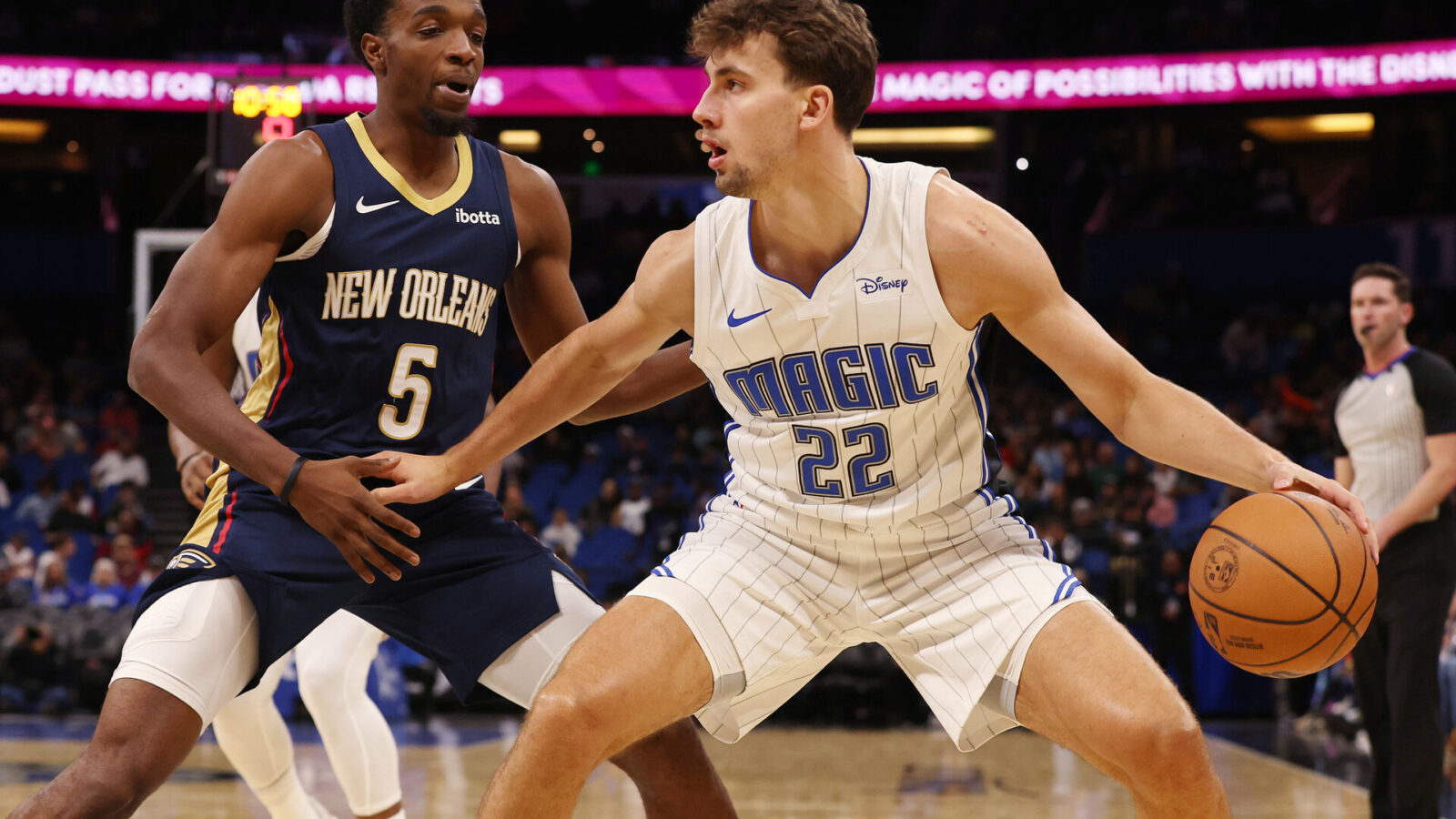 Oct 17, 2023; Orlando, Florida, USA; Orlando Magic forward Franz Wagner (22) drives as New Orleans Pelicans forward Herbert Jones (5) defends during the first quarter at Amway Center.