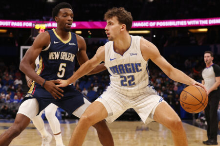 Oct 17, 2023; Orlando, Florida, USA; Orlando Magic forward Franz Wagner (22) drives as New Orleans Pelicans forward Herbert Jones (5) defends during the first quarter at Amway Center.
