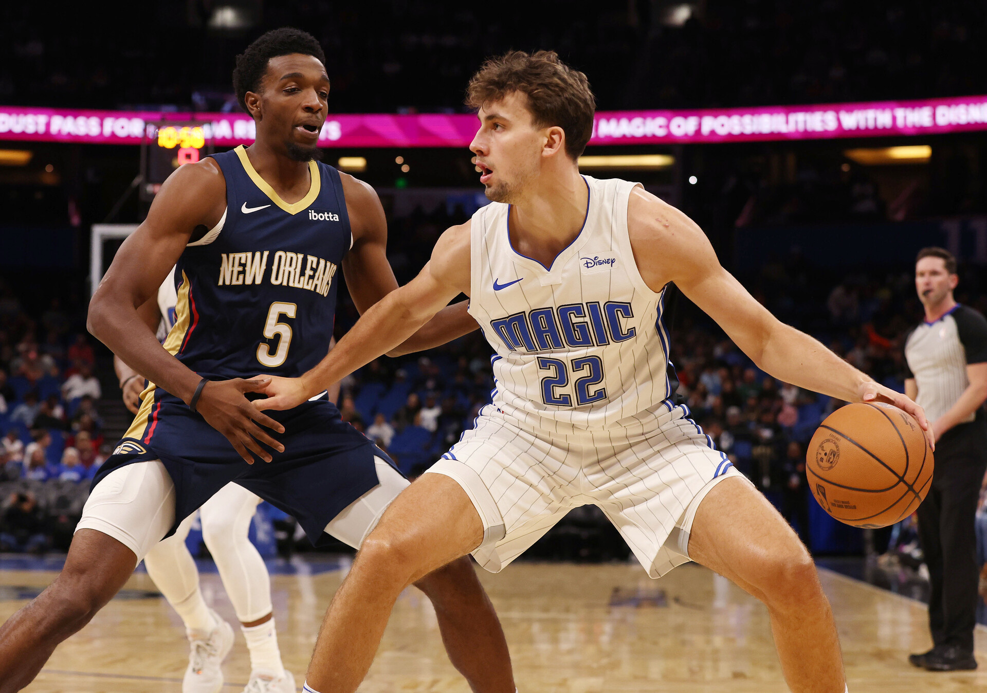Oct 17, 2023; Orlando, Florida, USA; Orlando Magic forward Franz Wagner (22) drives as New Orleans Pelicans forward Herbert Jones (5) defends during the first quarter at Amway Center.