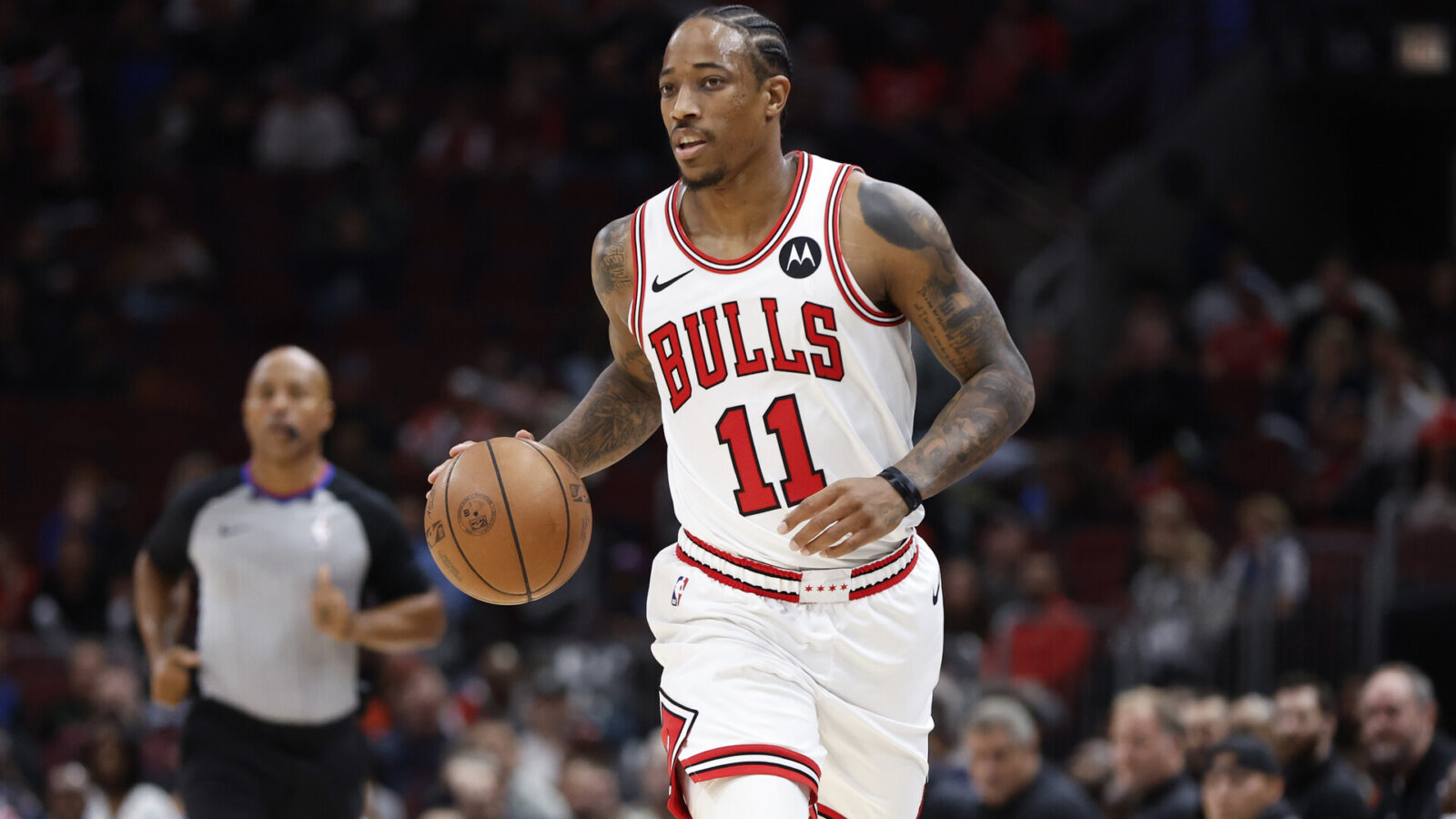 Oct 19, 2023; Chicago, Illinois, USA; Chicago Bulls forward DeMar DeRozan (11) brings the ball up court against the Minnesota Timberwolves during the first half at United Center.