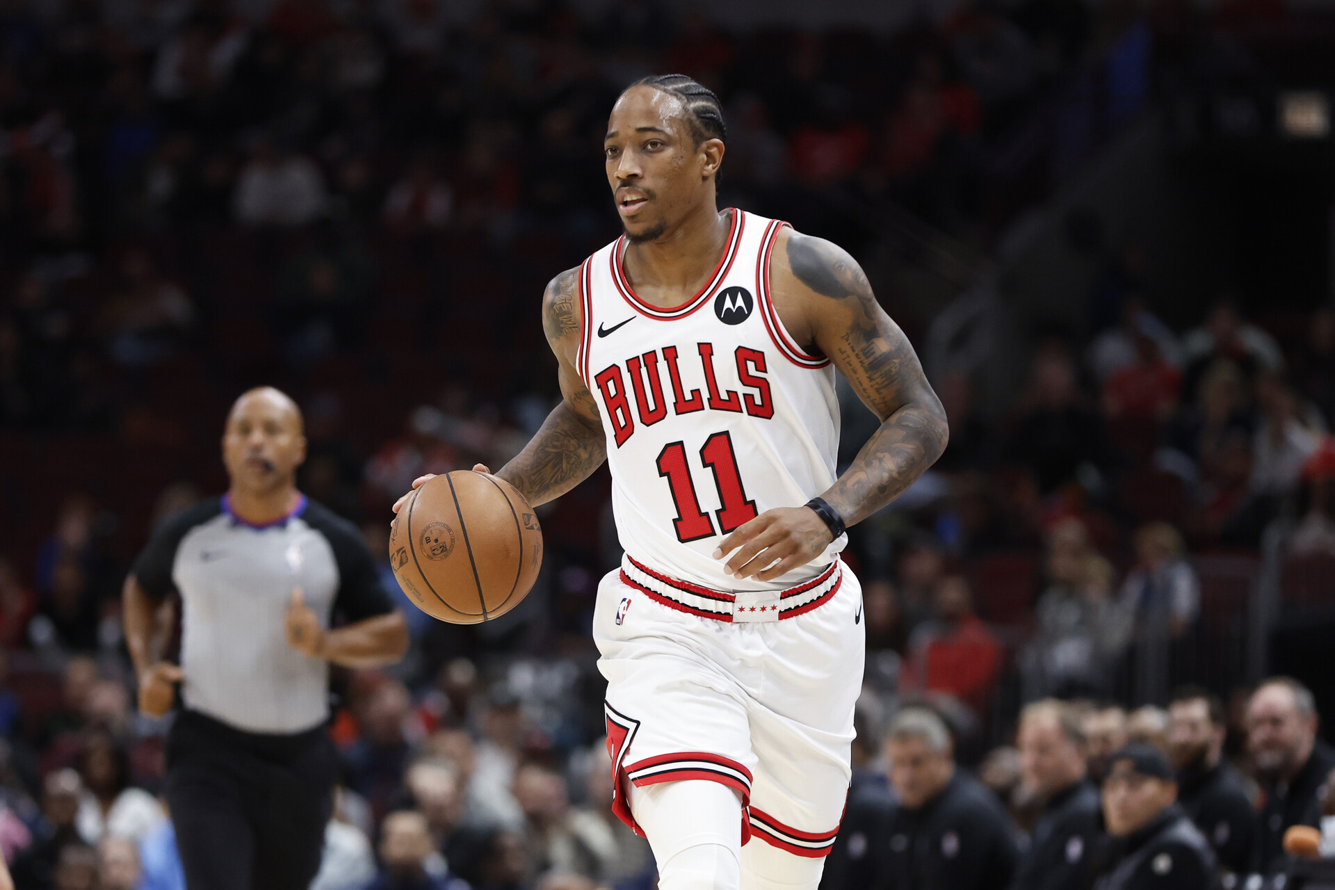 Oct 19, 2023; Chicago, Illinois, USA; Chicago Bulls forward DeMar DeRozan (11) brings the ball up court against the Minnesota Timberwolves during the first half at United Center.