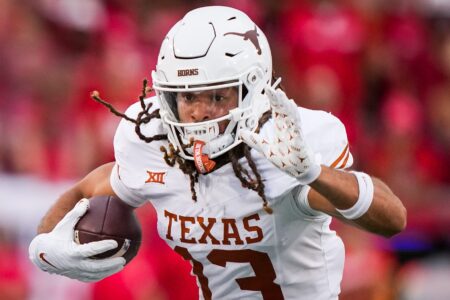 Texas wide receiver Jordan Whittington (13) runs with the ball in the fourth quarter of the Longhorn's game against the Houston Cougars at TDECU Stadium in Houston, Saturday, Oct. 21, 2023. Texas won the game 31-24.