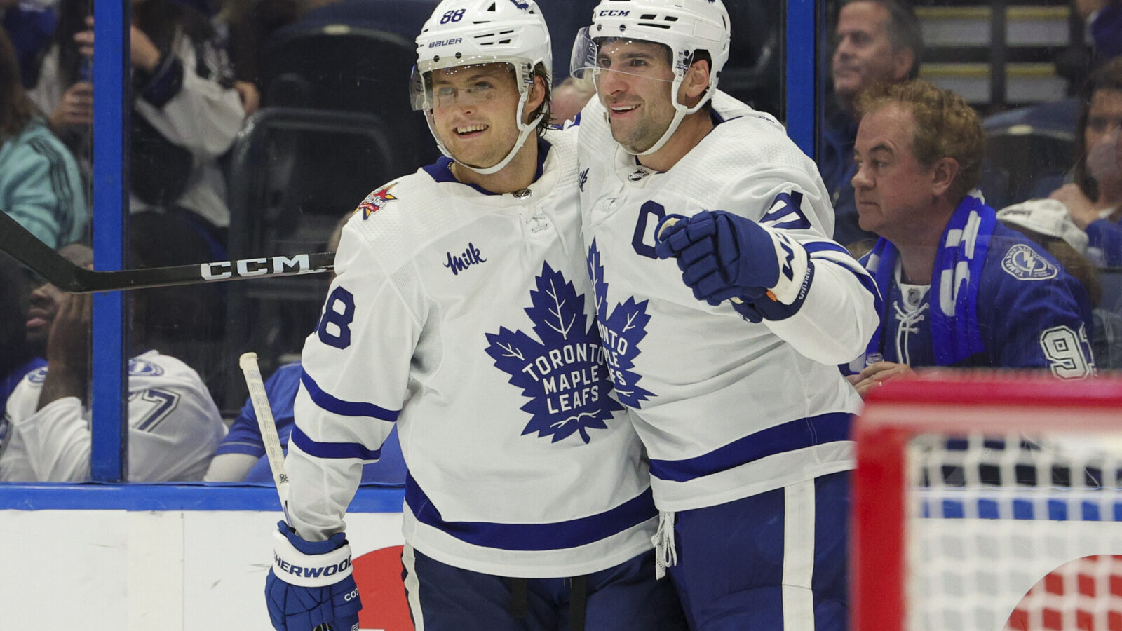 Oct 21, 2023; Tampa, Florida, USA; Toronto Maple Leafs center John Tavares (91) celebrates with Toronto Maple Leafs right wing William Nylander (88) after scoring a goal in overtime against the Tampa Bay Lightning at Amalie Arena.