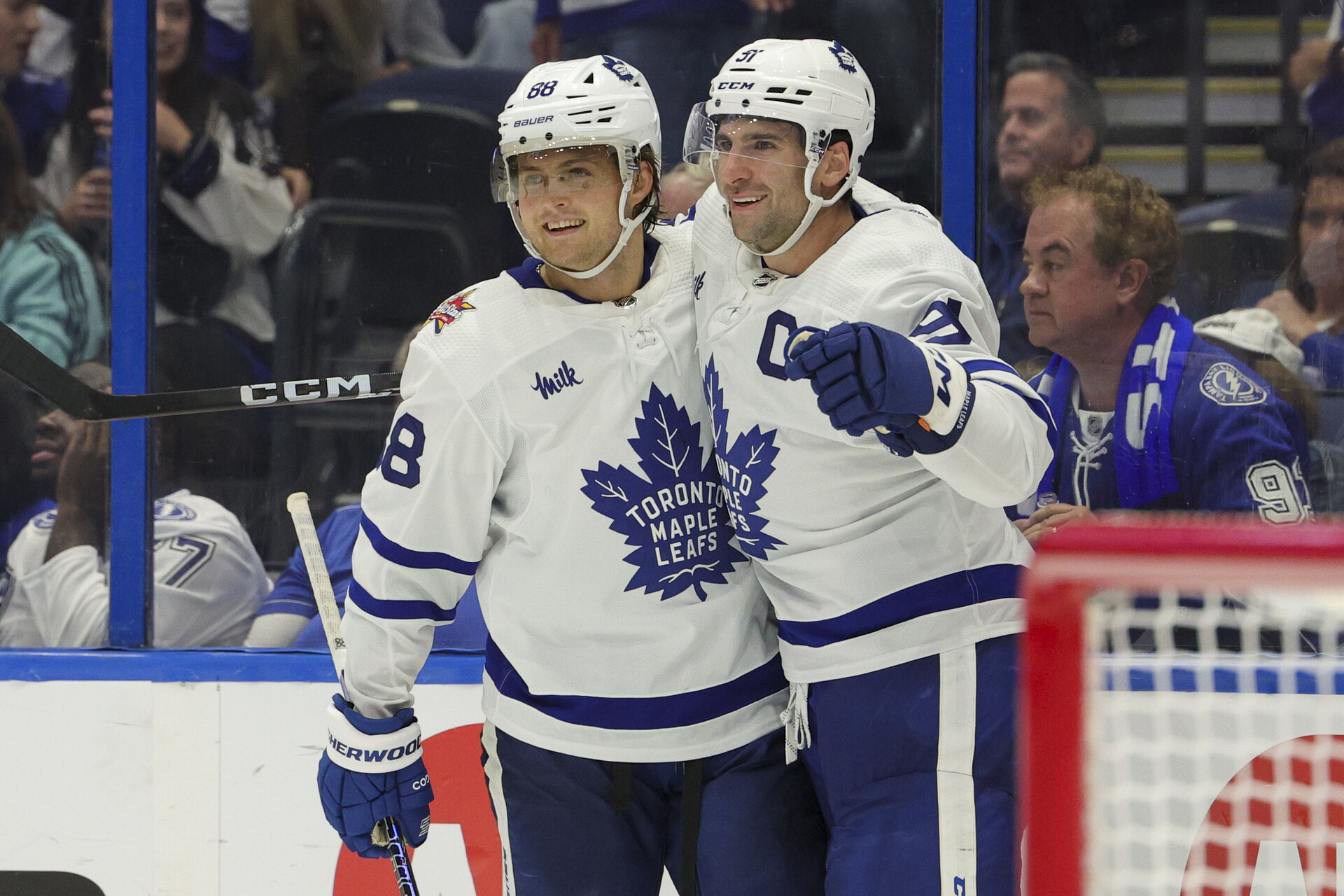 Oct 21, 2023; Tampa, Florida, USA; Toronto Maple Leafs center John Tavares (91) celebrates with Toronto Maple Leafs right wing William Nylander (88) after scoring a goal in overtime against the Tampa Bay Lightning at Amalie Arena.