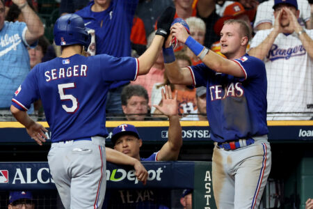 Oct 23, 2023; Houston, Texas, USA; Texas Rangers shortstop Corey Seager (5) and third baseman Josh Jung (6) celebrate after a run during the fourth inning of game seven in the ALCS against the Houston Astros for the 2023 MLB playoffs at Minute Maid Park.