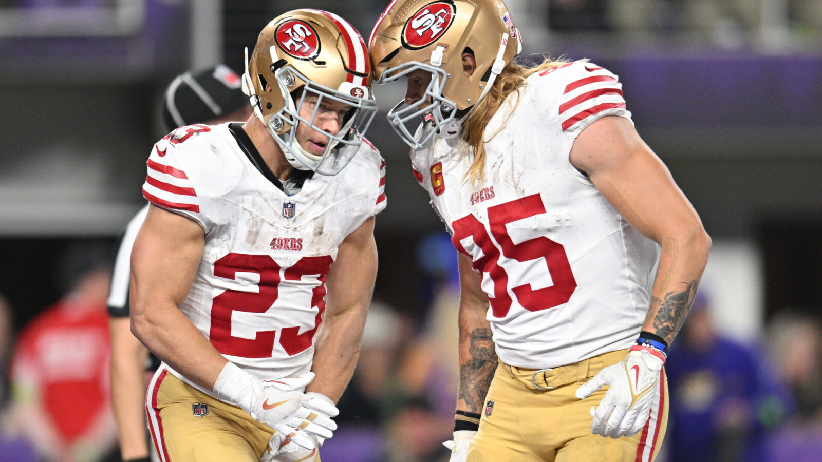 Oct 23, 2023; Minneapolis, Minnesota, USA; San Francisco 49ers running back Christian McCaffrey (23) and tight end George Kittle (85) react after a touchdown by McCaffrey against the Minnesota Vikings during the third quarter at U.S. Bank Stadium.