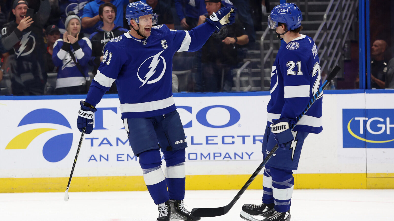 Oct 24, 2023; Tampa, Florida, USA; Tampa Bay Lightning center Steven Stamkos (91) celebrates with Tampa Bay Lightning center Brayden Point (21) after he scored a goal against the Carolina Hurricanes during the first period at Amalie Arena.