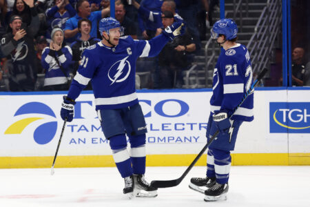 Oct 24, 2023; Tampa, Florida, USA; Tampa Bay Lightning center Steven Stamkos (91) celebrates with Tampa Bay Lightning center Brayden Point (21) after he scored a goal against the Carolina Hurricanes during the first period at Amalie Arena.