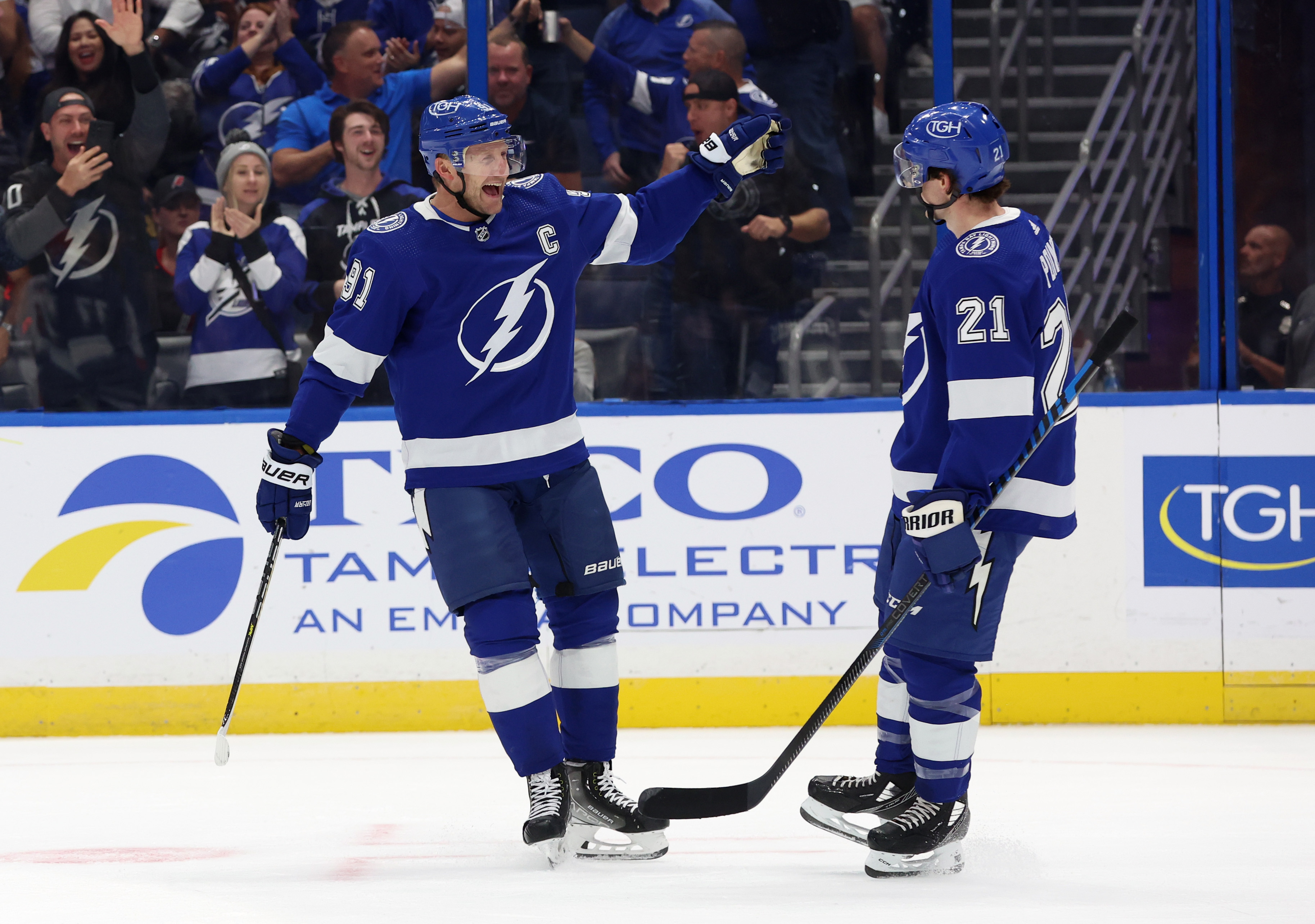 Oct 24, 2023; Tampa, Florida, USA; Tampa Bay Lightning center Steven Stamkos (91) celebrates with Tampa Bay Lightning center Brayden Point (21) after he scored a goal against the Carolina Hurricanes during the first period at Amalie Arena.
