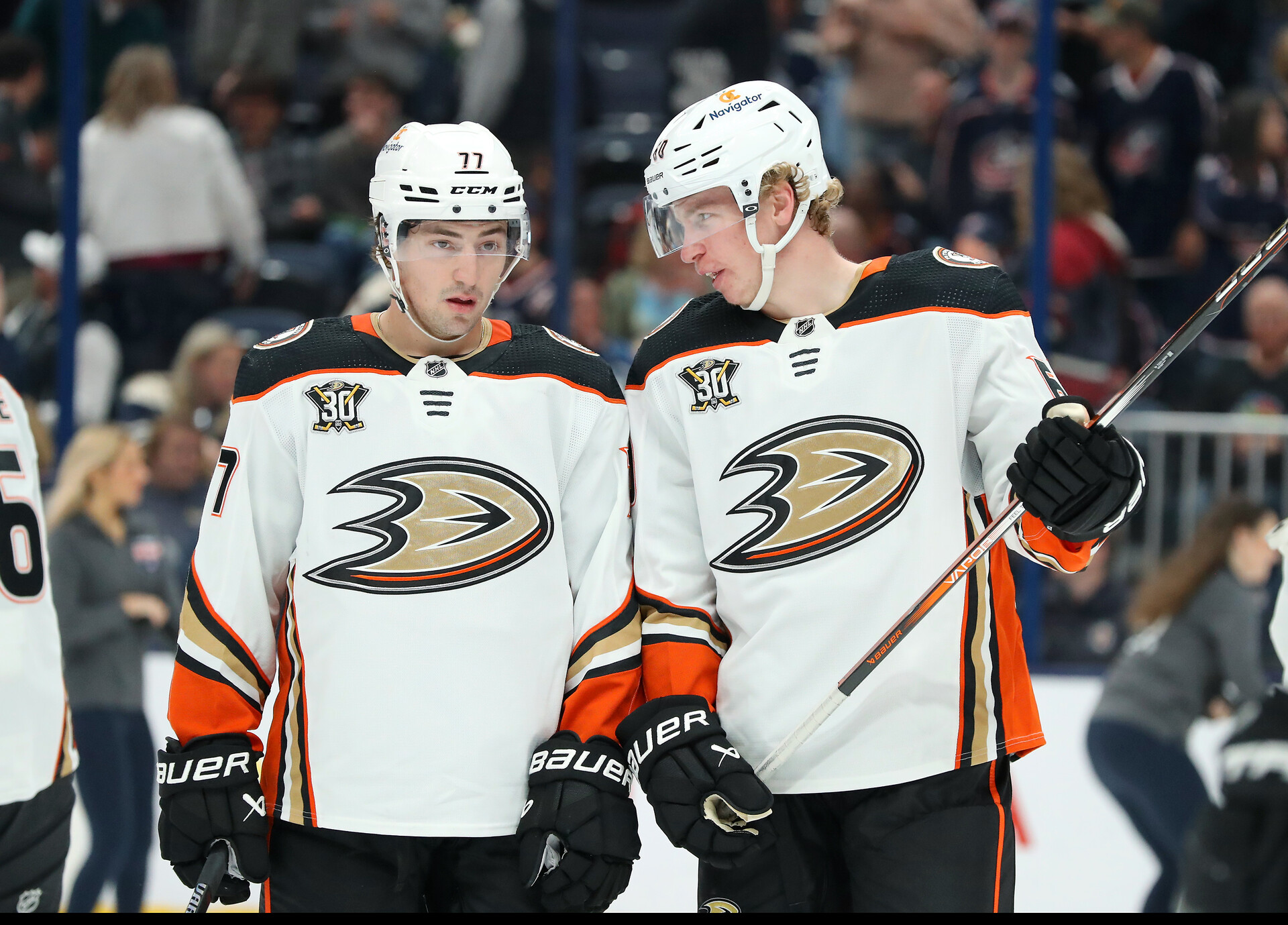 Anaheim Ducks right wing Frank Vatrano (77) and defenseman Jackson LaCombe (60) talk during the second period against the Columbus Blue Jackets at Nationwide Arena.
