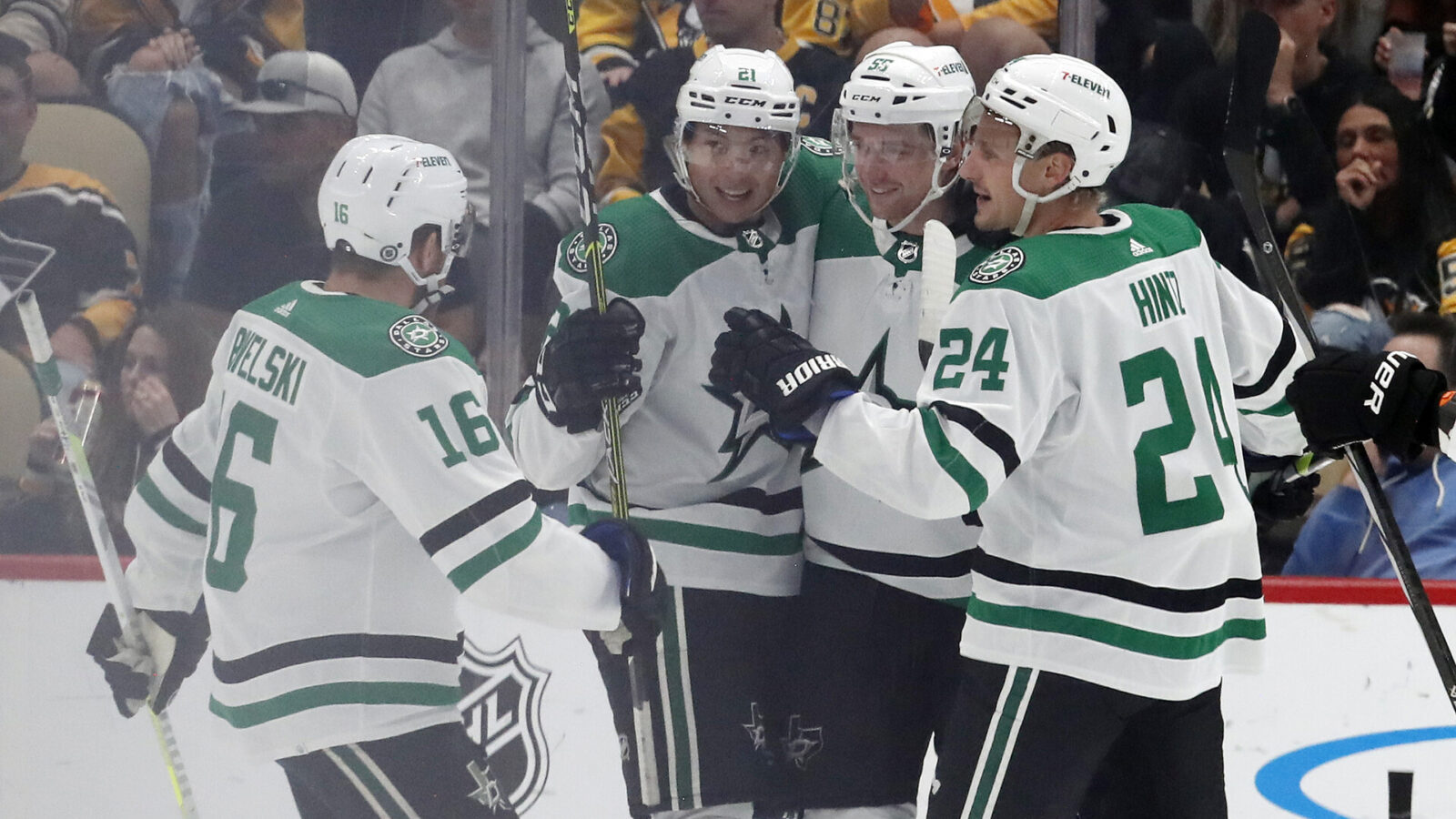 Dallas Stars defenseman Thomas Harley (55) is congratulated after scoring a goal by center Joe Pavelski (16) and left wing Jason Robertson (21) and center Roope Hintz (24) against the Pittsburgh Penguins during the third period at PPG Paints Arena. Dallas won 4-1.