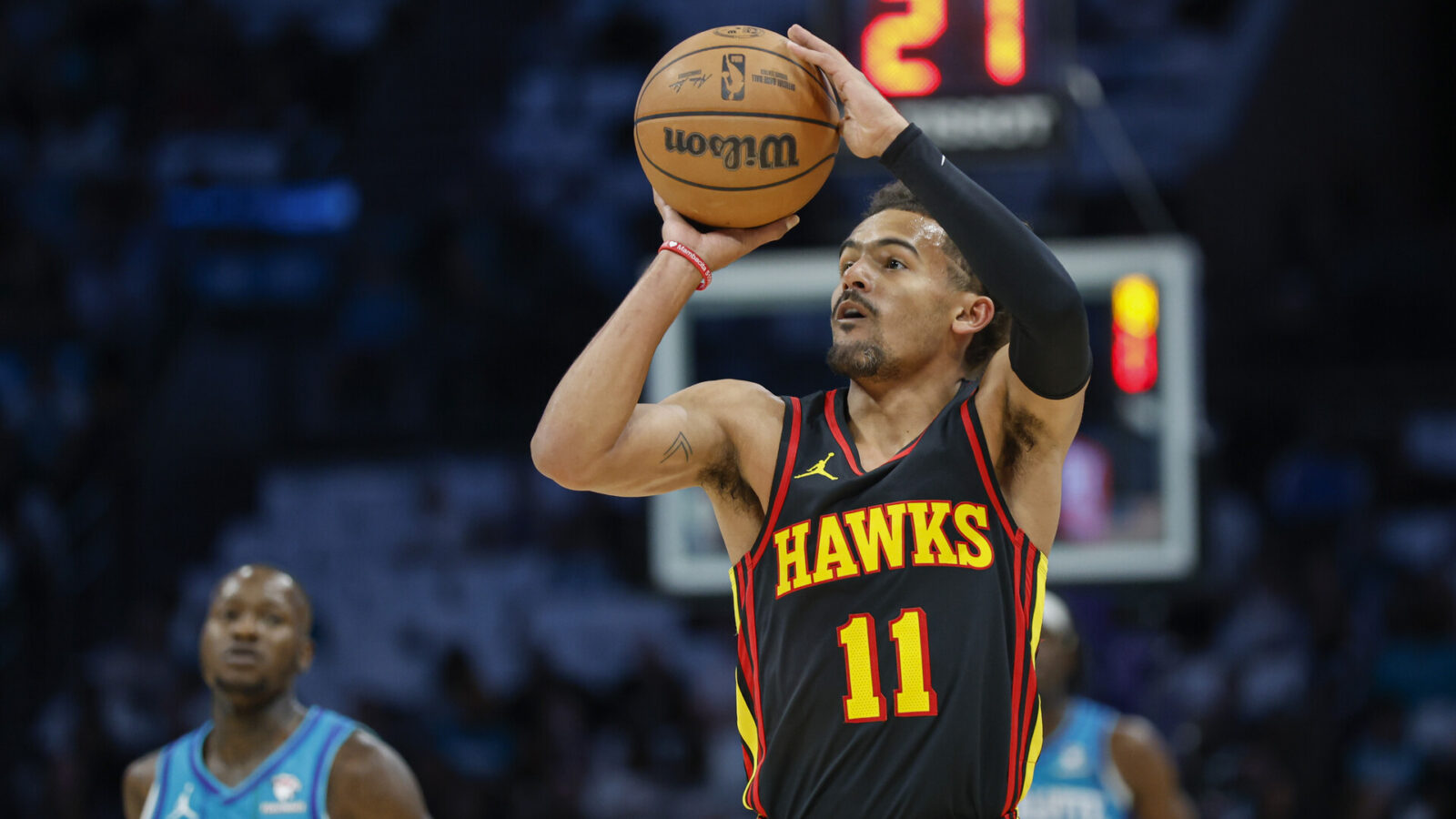 Oct 25, 2023; Charlotte, North Carolina, USA; Atlanta Hawks guard Trae Young (11) shoots against the Charlotte Hornets during the first quarter at Spectrum Center.