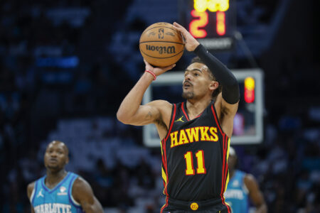 Oct 25, 2023; Charlotte, North Carolina, USA; Atlanta Hawks guard Trae Young (11) shoots against the Charlotte Hornets during the first quarter at Spectrum Center.
