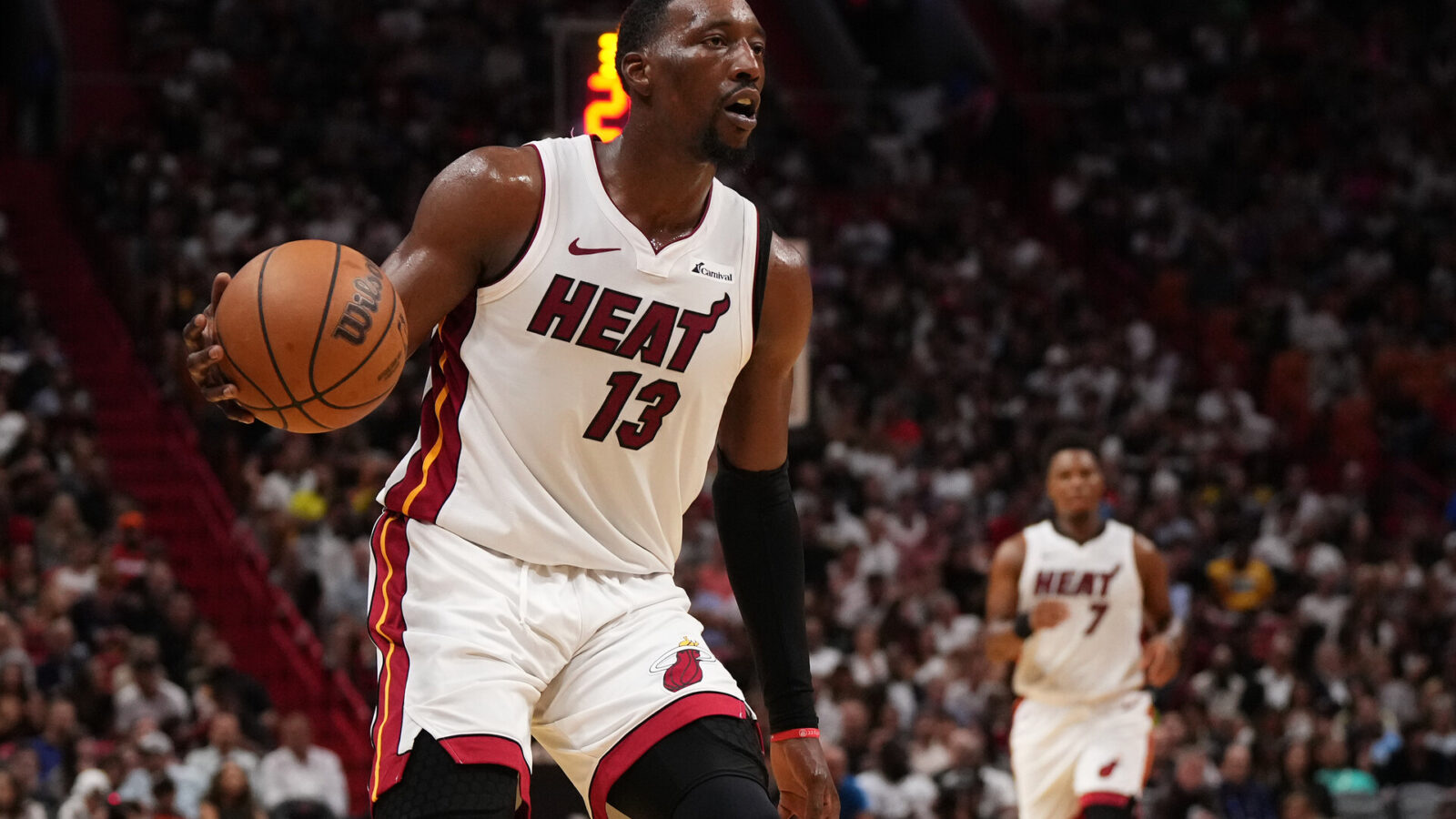 Oct 25, 2023; Miami, Florida, USA; Miami Heat center Bam Adebayo (13) dribbles the ball up the court against the Detroit Pistons during the first second half at Kaseya Center.