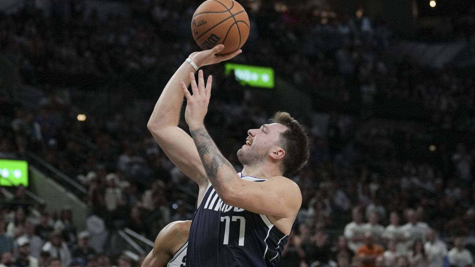 Oct 25, 2023; San Antonio, Texas, USA; Dallas Mavericks guard Luka Doncic (77) shoots in the second half against the San Antonio Spurs at the Frost Bank Center.