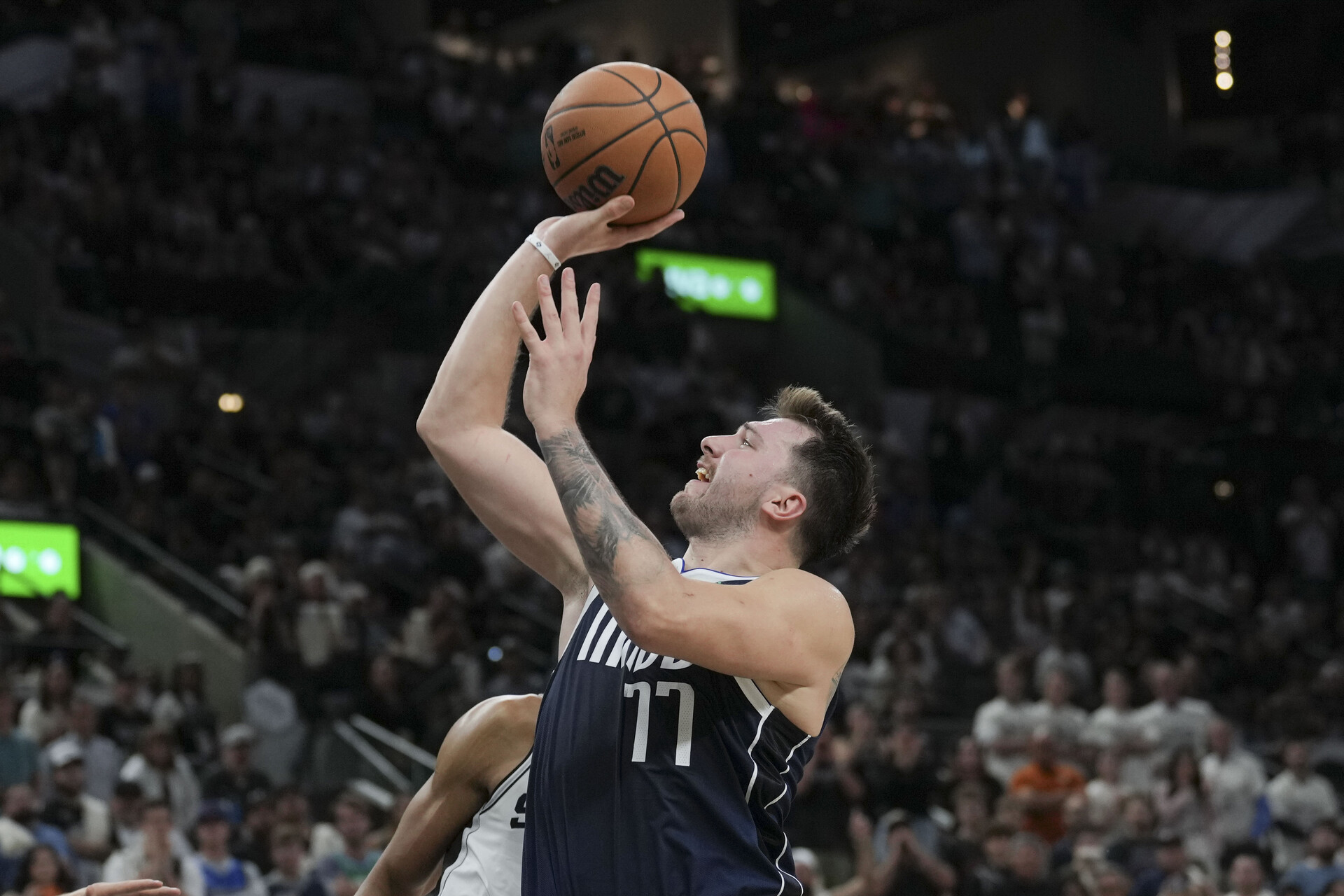 Oct 25, 2023; San Antonio, Texas, USA; Dallas Mavericks guard Luka Doncic (77) shoots in the second half against the San Antonio Spurs at the Frost Bank Center.
