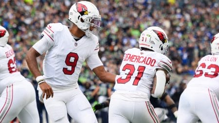 Oct 22, 2023; Seattle, Washington, USA; Arizona Cardinals quarterback Joshua Dobbs (9) hands the ball to Arizona Cardinals running back Emari Demercado (31) during the game at Lumen Field.