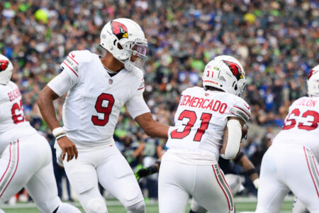 Oct 22, 2023; Seattle, Washington, USA; Arizona Cardinals quarterback Joshua Dobbs (9) hands the ball to Arizona Cardinals running back Emari Demercado (31) during the game at Lumen Field.