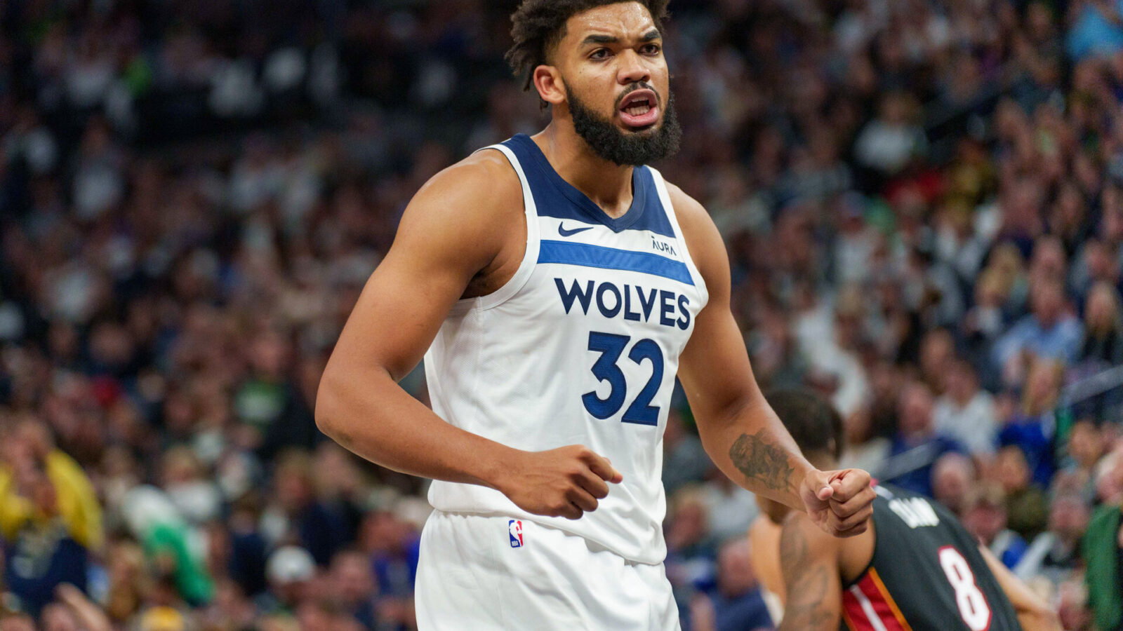 Oct 28, 2023; Minneapolis, Minnesota, USA; Minnesota Timberwolves center Karl-Anthony Towns (32) celebrates a basket against the Miami Heat in the third quarter at Target Center.