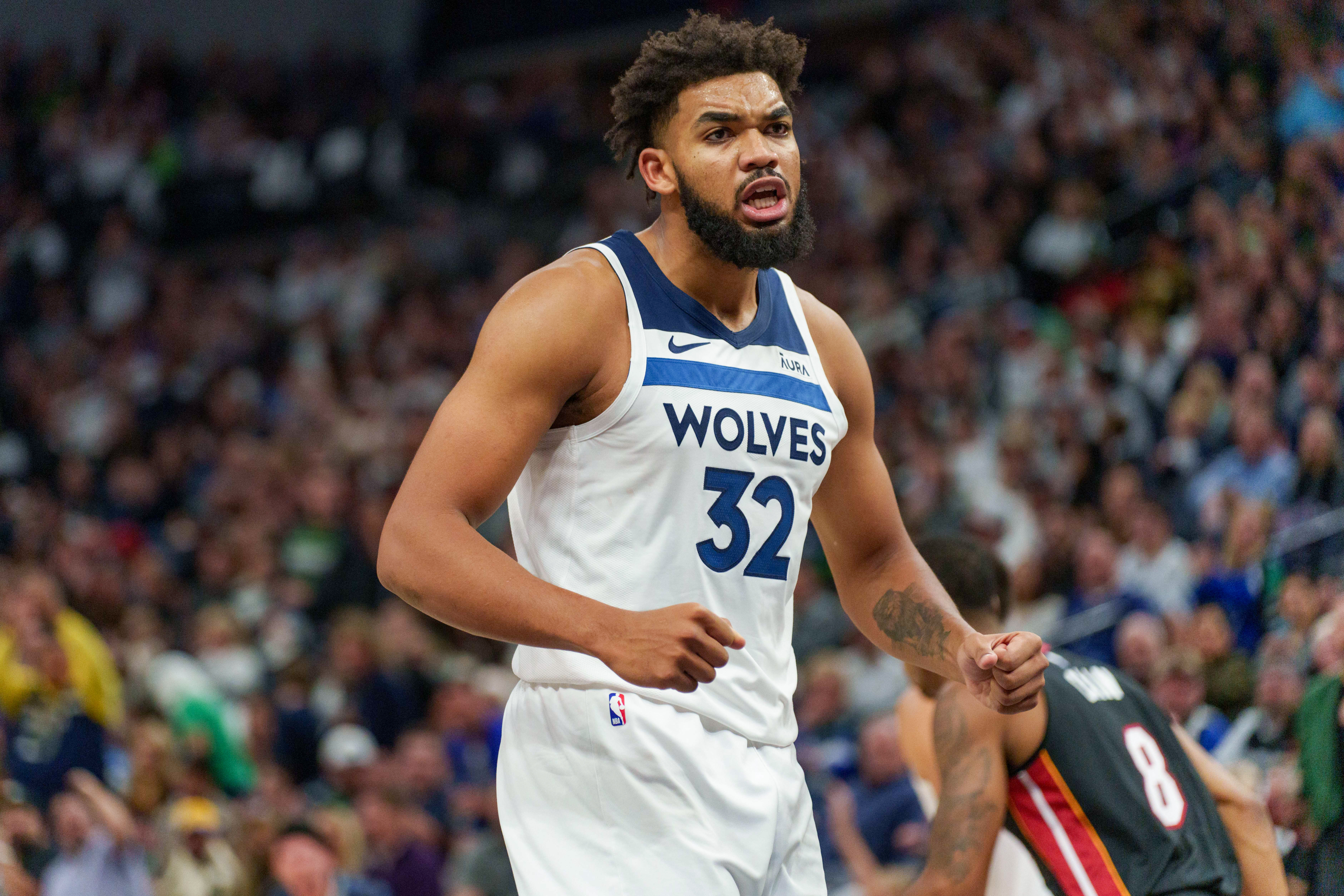 Oct 28, 2023; Minneapolis, Minnesota, USA; Minnesota Timberwolves center Karl-Anthony Towns (32) celebrates a basket against the Miami Heat in the third quarter at Target Center.