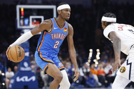 Oct 29, 2023; Oklahoma City, Oklahoma, USA; Oklahoma City Thunder guard Shai Gilgeous-Alexander (2) drives against Denver Nuggets guard Kentavious Caldwell-Pope (5) during the second half at Paycom Center.