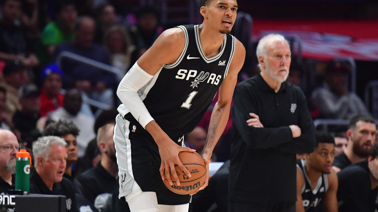 Oct 29, 2023; Los Angeles, California, USA; San Antonio Spurs center Victor Wembanyama (1) controls the ball against the Los Angeles Clippers during the first half at Crypto.com Arena.