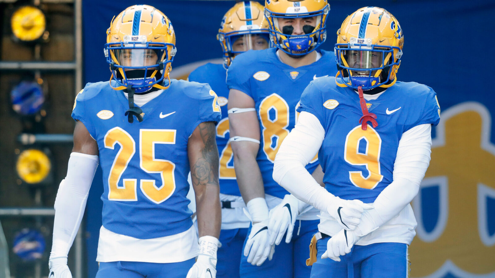 Nov 19, 2022; Pittsburgh, Pennsylvania, USA; Pittsburgh Panthers defensive back A.J. Woods (25) and tight end Gavin Bartholomew (86) and defensive back Brandon Hill (9) take the field to warm up before the game against the Duke Blue Devils at Acrisure Stadium.