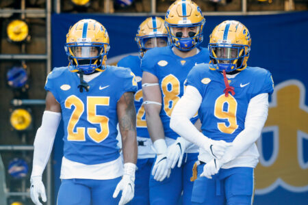 Nov 19, 2022; Pittsburgh, Pennsylvania, USA; Pittsburgh Panthers defensive back A.J. Woods (25) and tight end Gavin Bartholomew (86) and defensive back Brandon Hill (9) take the field to warm up before the game against the Duke Blue Devils at Acrisure Stadium.