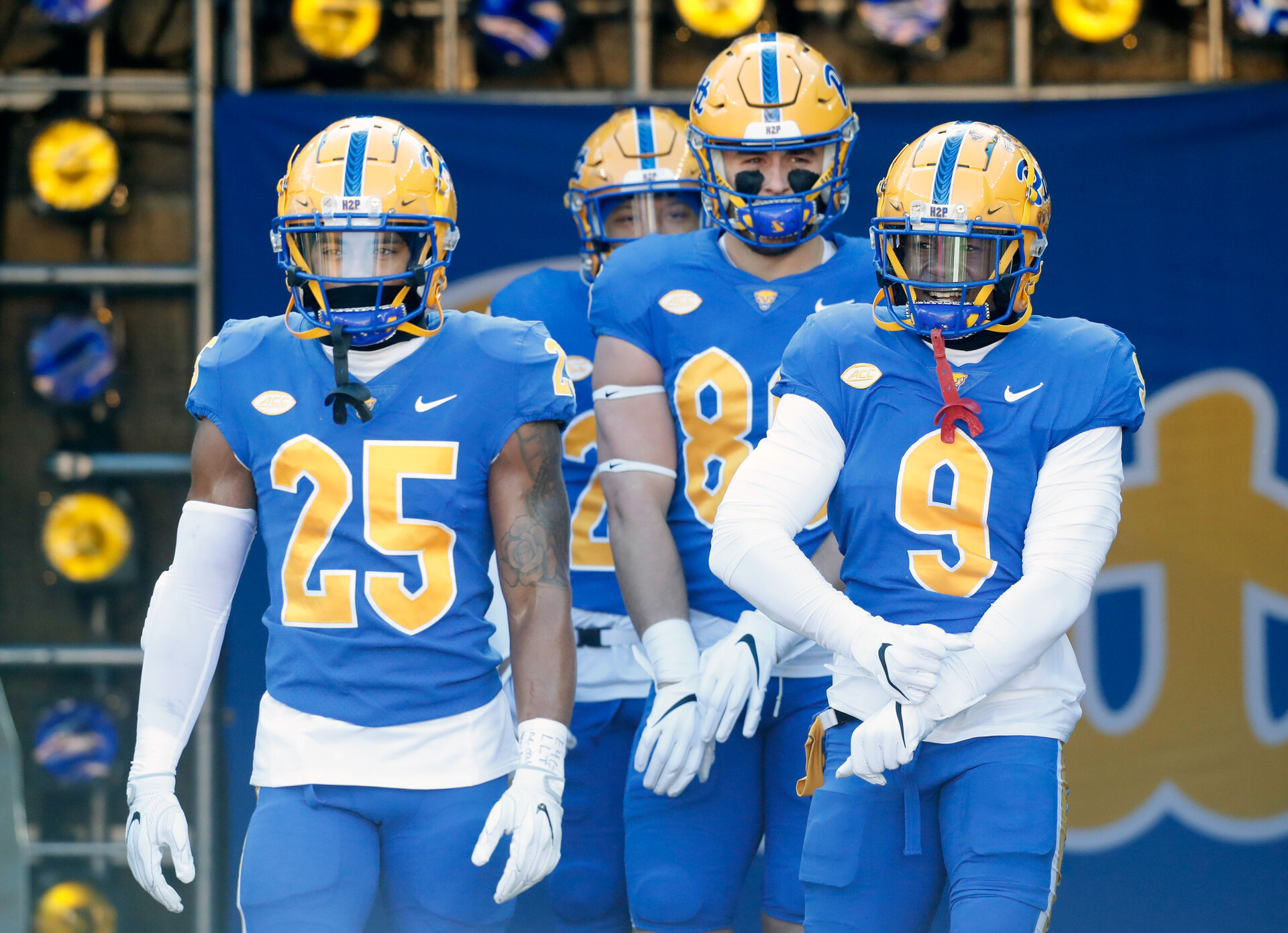 Nov 19, 2022; Pittsburgh, Pennsylvania, USA; Pittsburgh Panthers defensive back A.J. Woods (25) and tight end Gavin Bartholomew (86) and defensive back Brandon Hill (9) take the field to warm up before the game against the Duke Blue Devils at Acrisure Stadium.