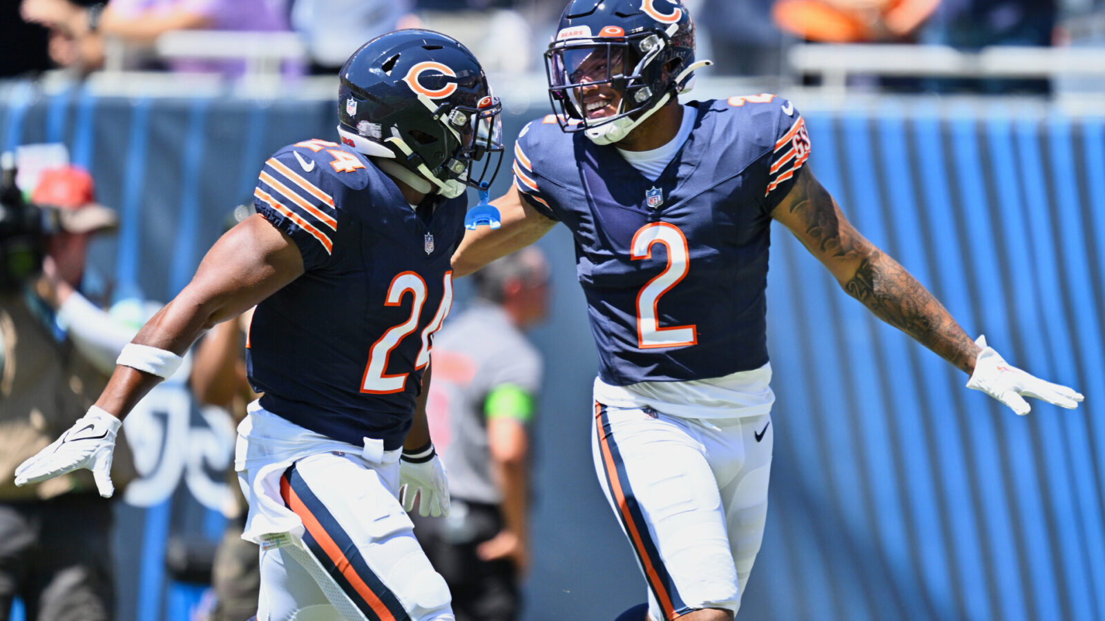 Chicago Bears wide receiver DJ Moore (2) celebrates with running back Khalil Herbert (24) after scoring on a 62-yard touchdown catch and run in the first quarter against the Tennessee Titans at Soldier Field.
