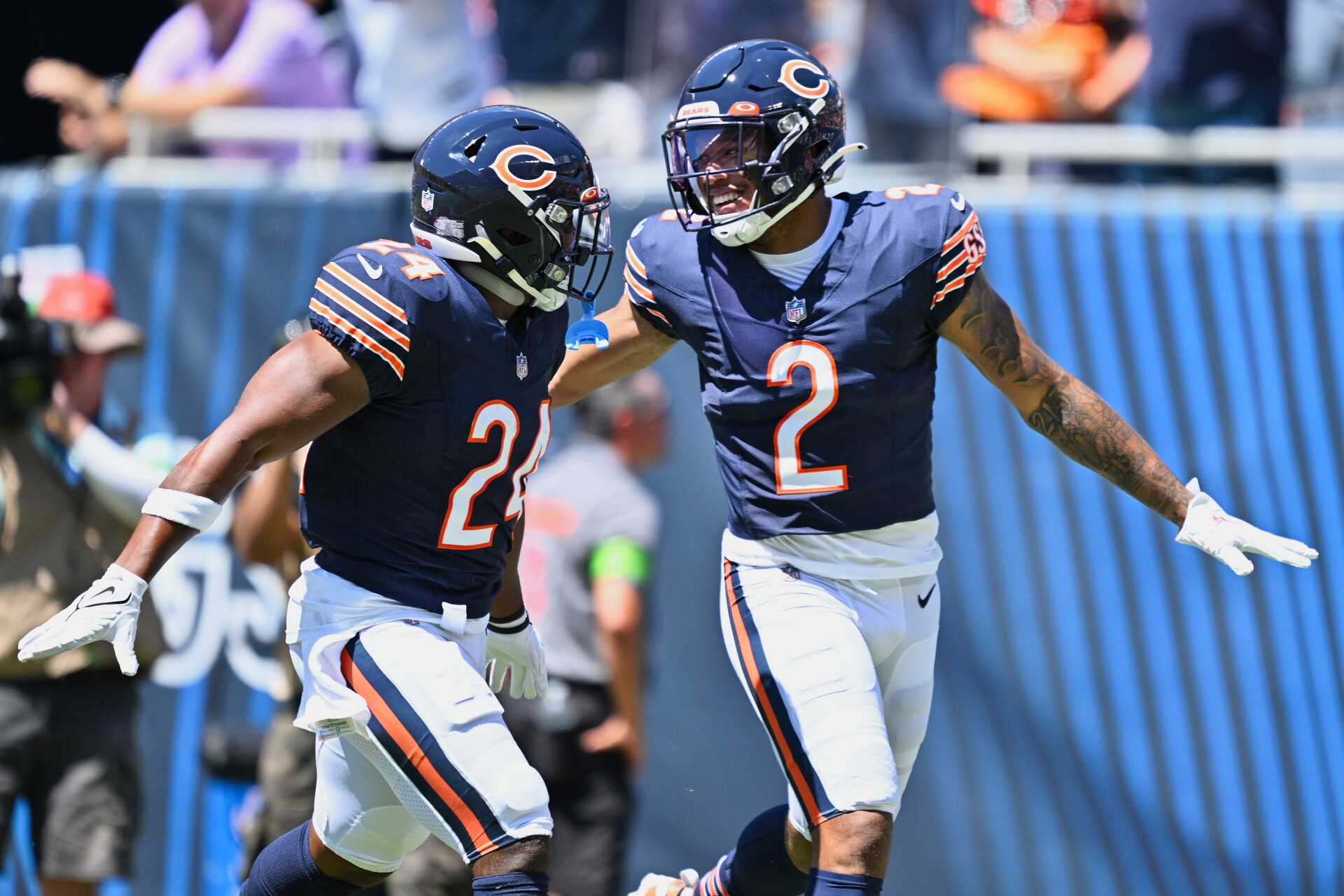 Chicago Bears wide receiver DJ Moore (2) celebrates with running back Khalil Herbert (24) after scoring on a 62-yard touchdown catch and run in the first quarter against the Tennessee Titans at Soldier Field.