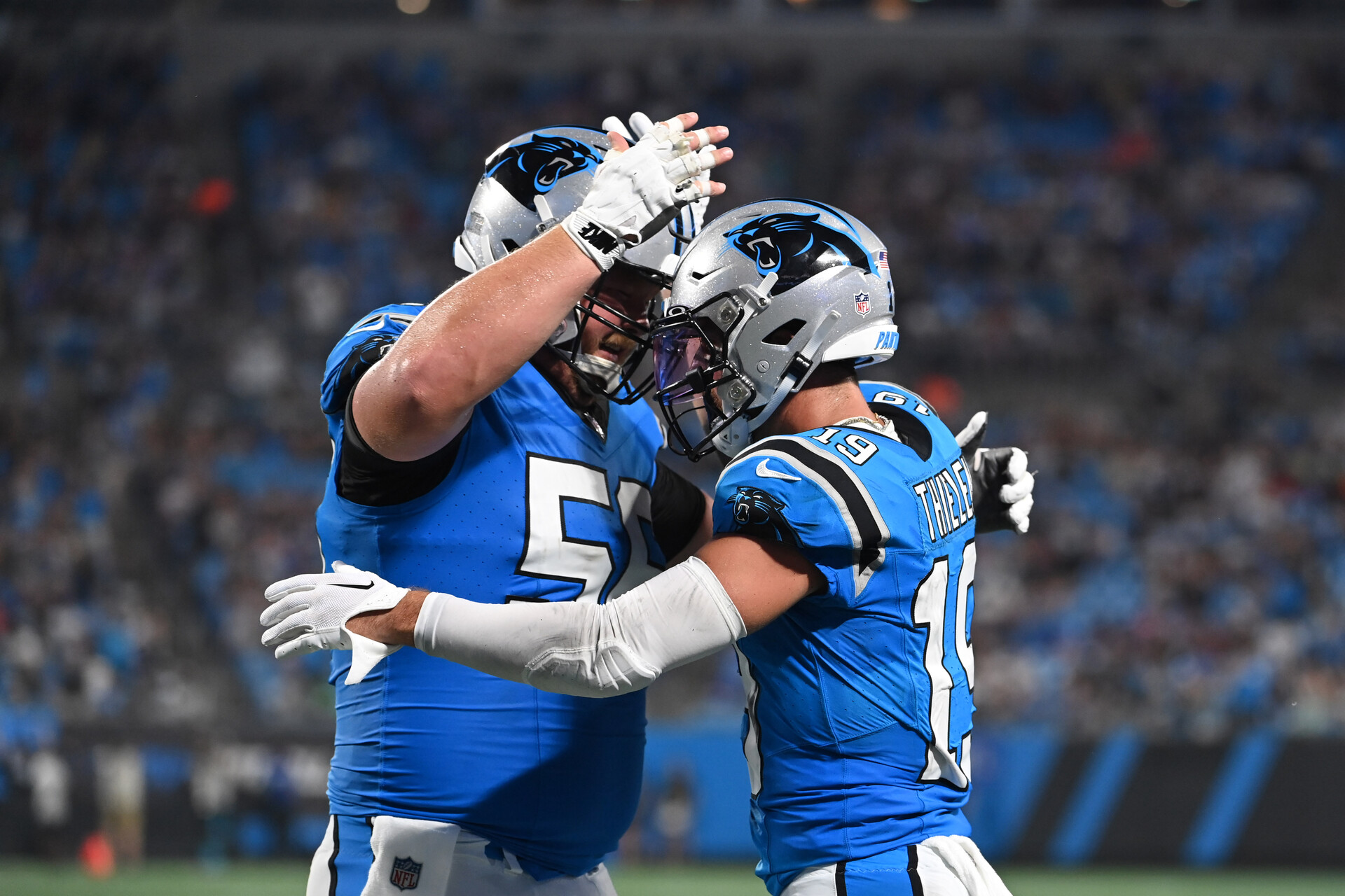 Aug 25, 2023; Charlotte, North Carolina, USA; Carolina Panthers wide receiver Adam Thielen (19) celebrates with center Bradley Bozeman (56) after scoring a touchdown in the first quarter at Bank of America Stadium.