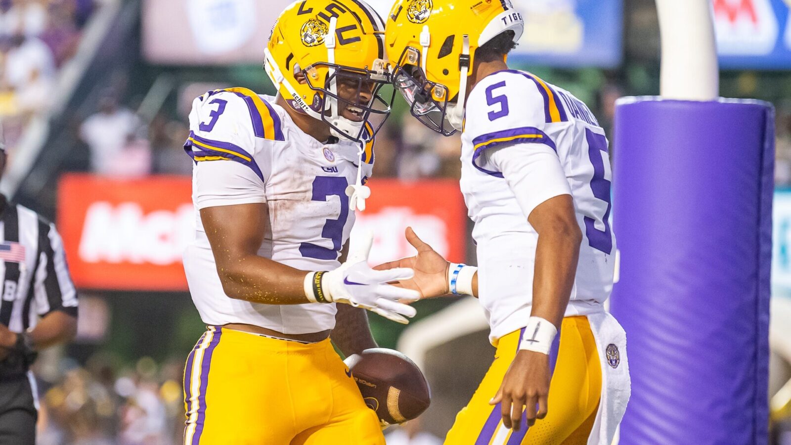 LSU Quarterback Jayden Daniels (5) celebrates with teammate Logan Diggs (3) after a touchdown against Grambling State.