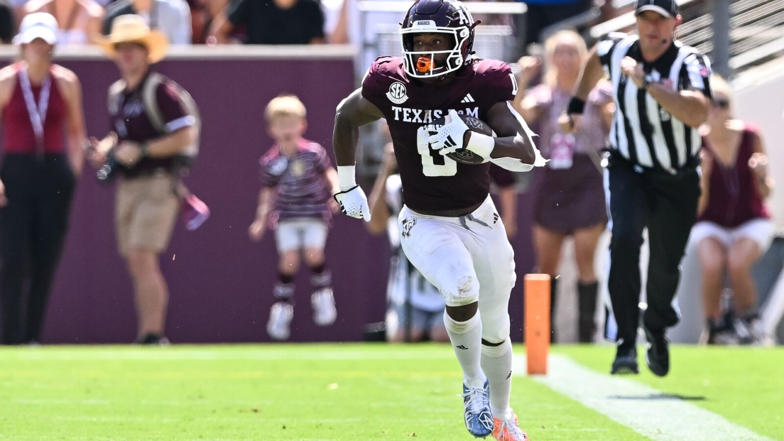 Sep 23, 2023; College Station, Texas, USA; Texas A&M Aggies wide receiver Ainias Smith (0) runs a punt during the first quarter against the Auburn Tigers at Kyle Field.