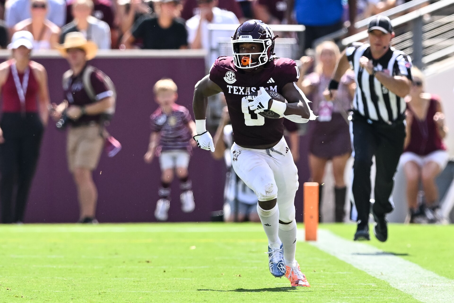 Sep 23, 2023; College Station, Texas, USA; Texas A&M Aggies wide receiver Ainias Smith (0) runs a punt during the first quarter against the Auburn Tigers at Kyle Field.