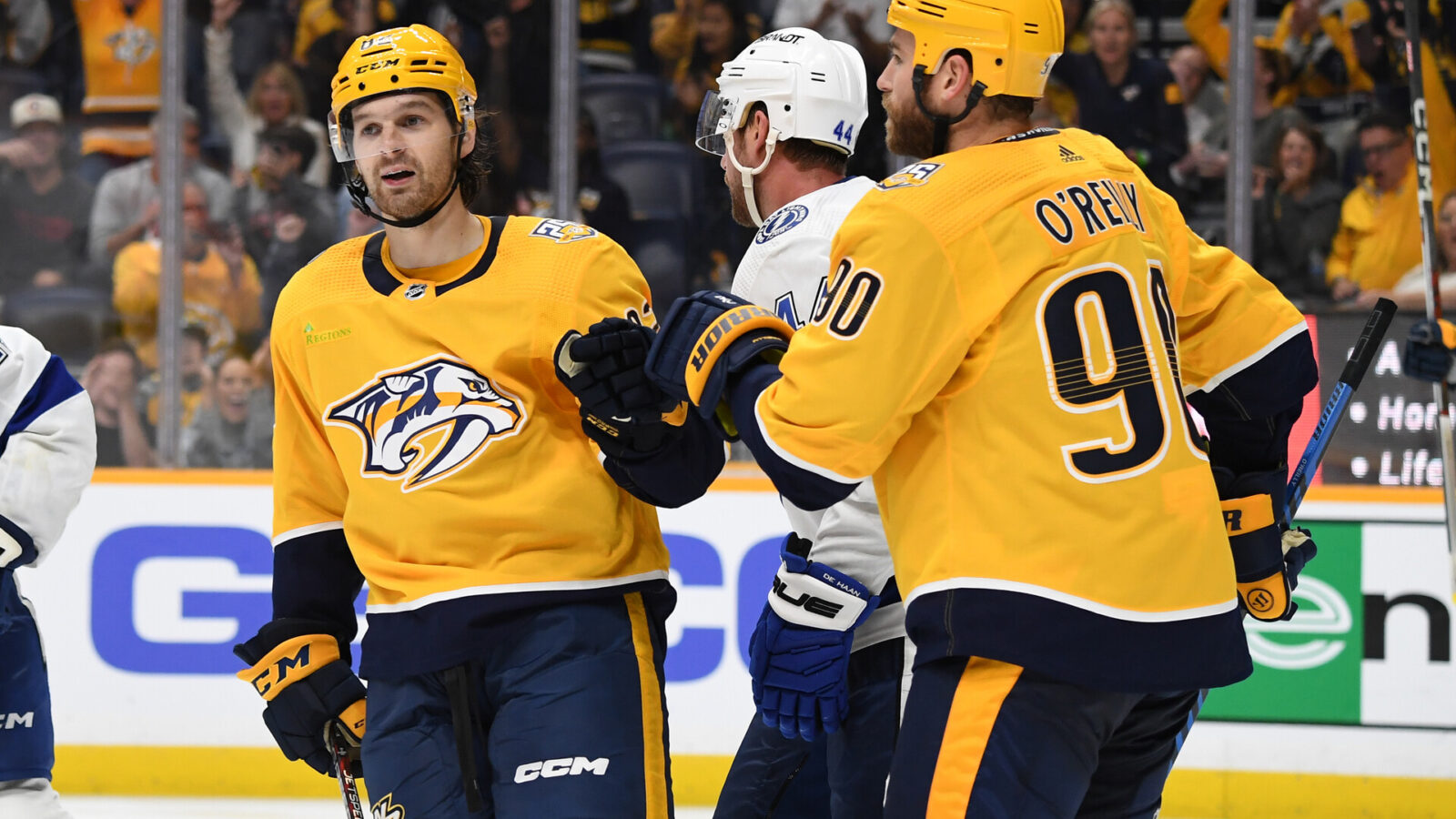 Nashville Predators center Thomas Novak (82) is congratulated by center Ryan O'Reilly (90) after scoring during the third period against the Tampa Bay Lightning at Bridgestone Arena.
