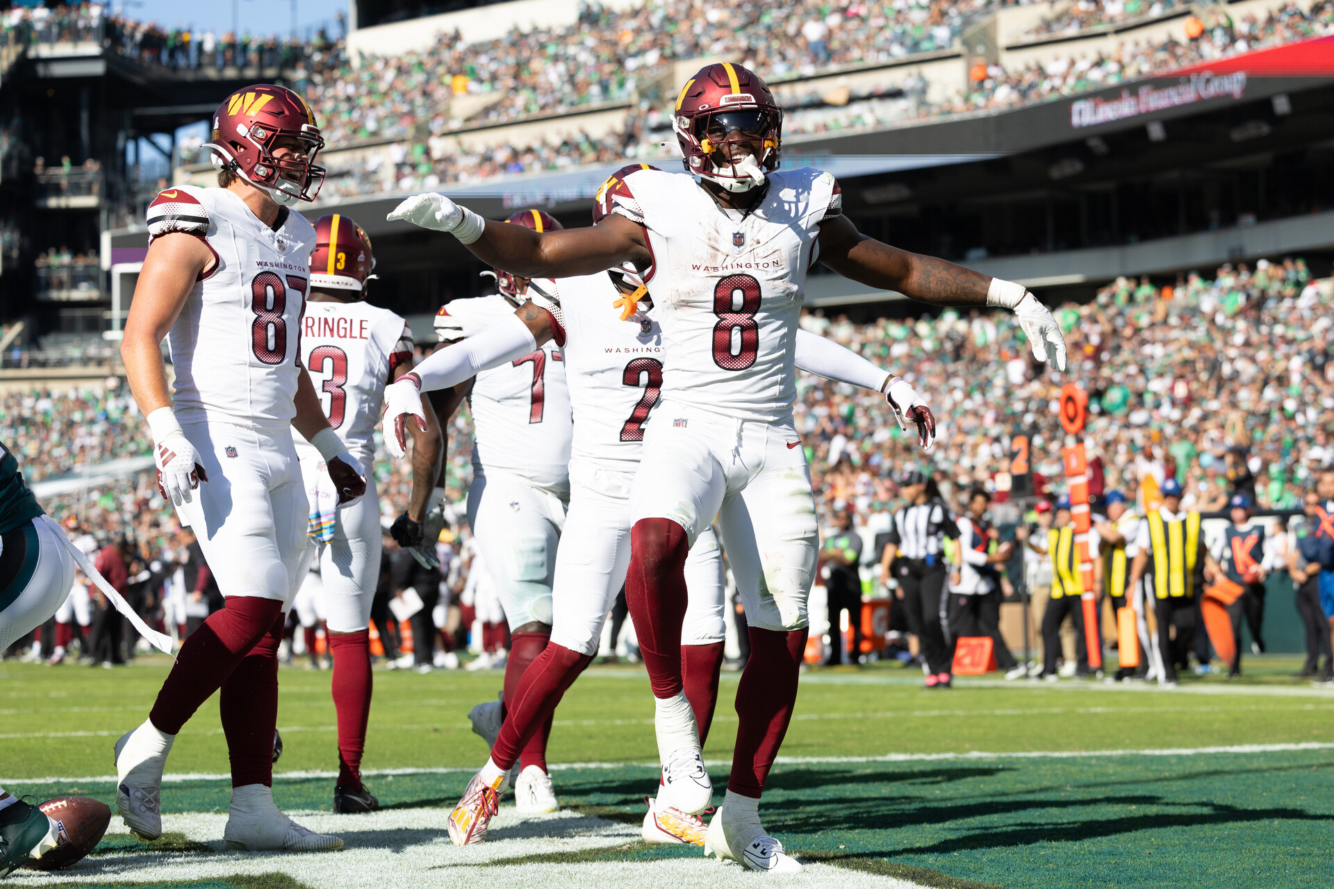 Oct 1, 2023; Philadelphia, Pennsylvania, USA; Washington Commanders running back Brian Robinson Jr. (8) celebrates his touchdown against the Philadelphia Eagles during the fourth quarter at Lincoln Financial Field